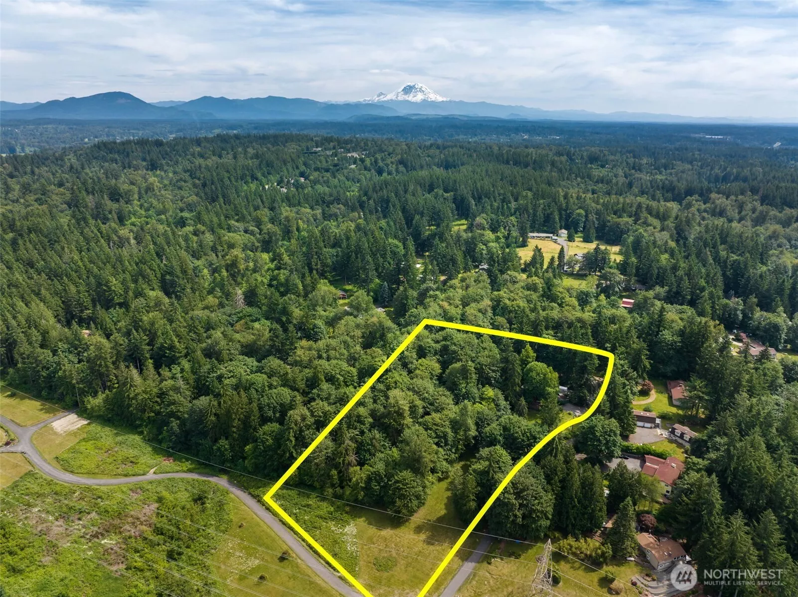 Nestled on a shy 5-acre parcel surrounded by nature, this property offers the perfect balance of privacy, recreation, and convenience. Gentle sloping lot down to the north, plenty of trees, but this could also be cleared more and made into pasture land as well, common in the neighborhood.