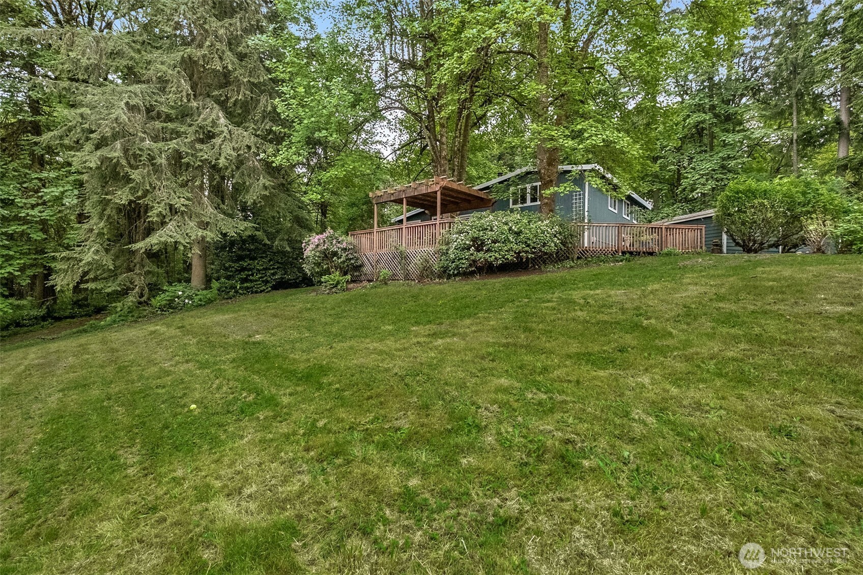 Half flight down the stairs is the family room with new carpet and free standing wood stove perfect to use in the winter time.