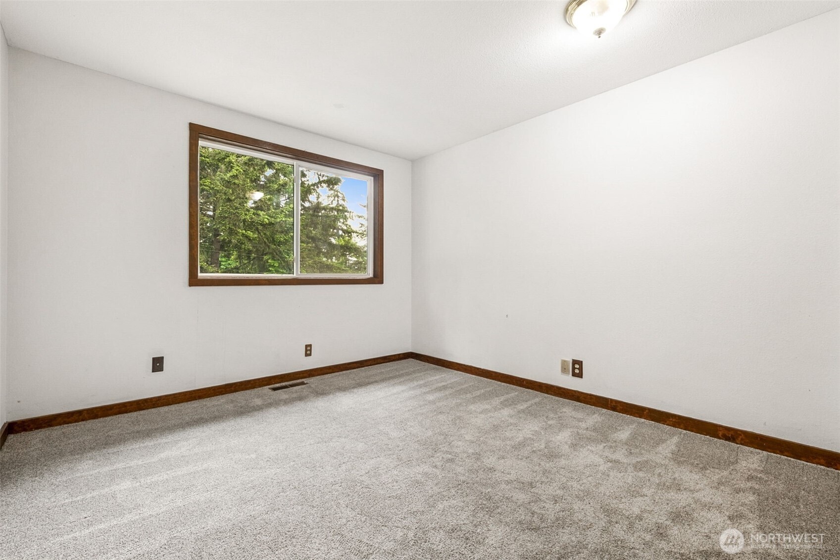 The fourth bedroom on the upper level is oversized with two closets.
