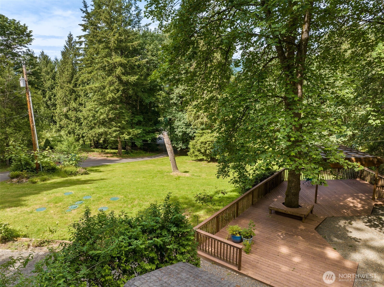 Outdoor deck with gazebo overlooks the beauty of the back yard!