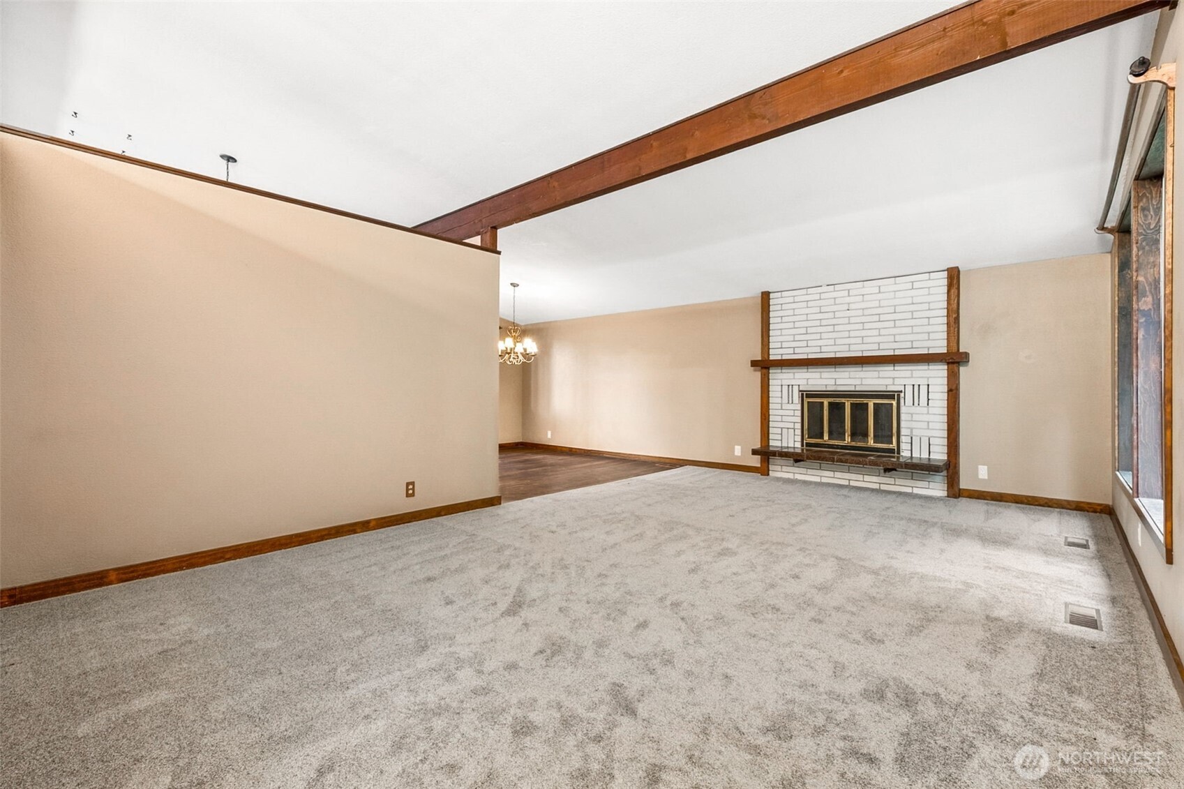 This is an easy floorplan to open up by removing the kitchen walls the face this room and the dining room. Very livable the way it is, new carpet and new flooring in the dining room area.