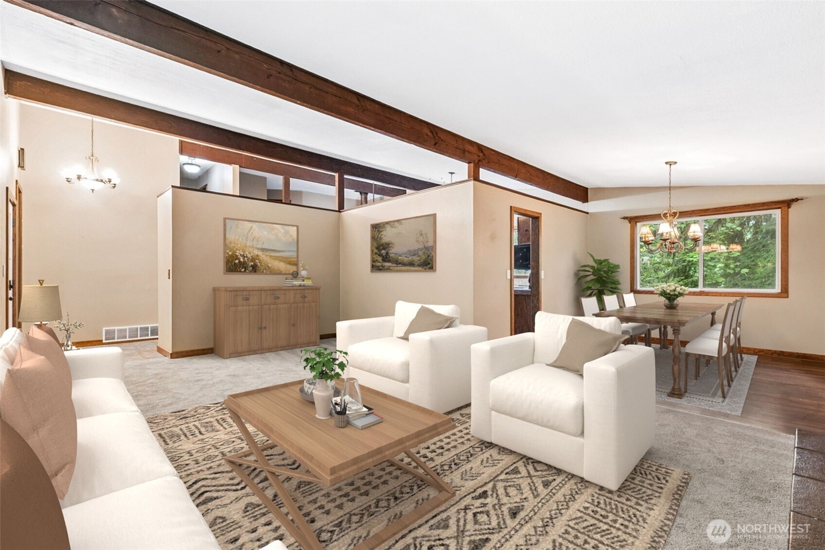 Another view looking towards the dining room and kitchen area. Vaulted ceilings lend a feeling of openess to the space.
