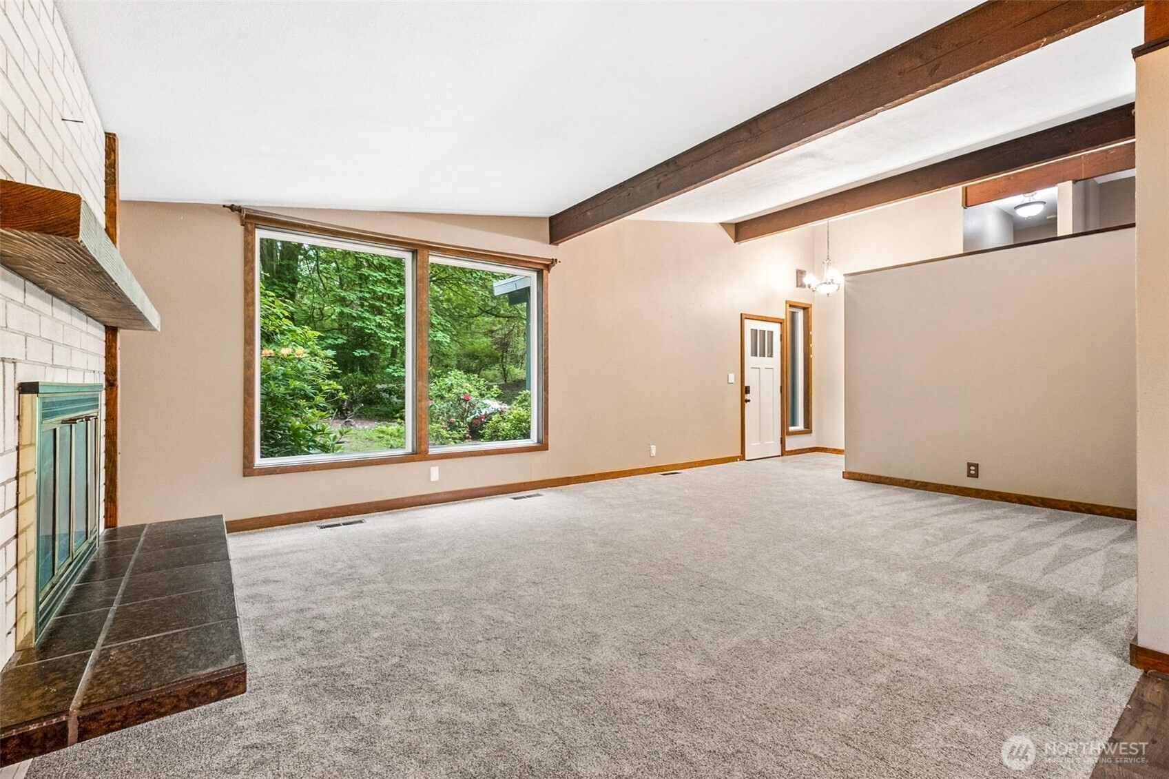 Large windows in this living room face the front of the home, or south.
