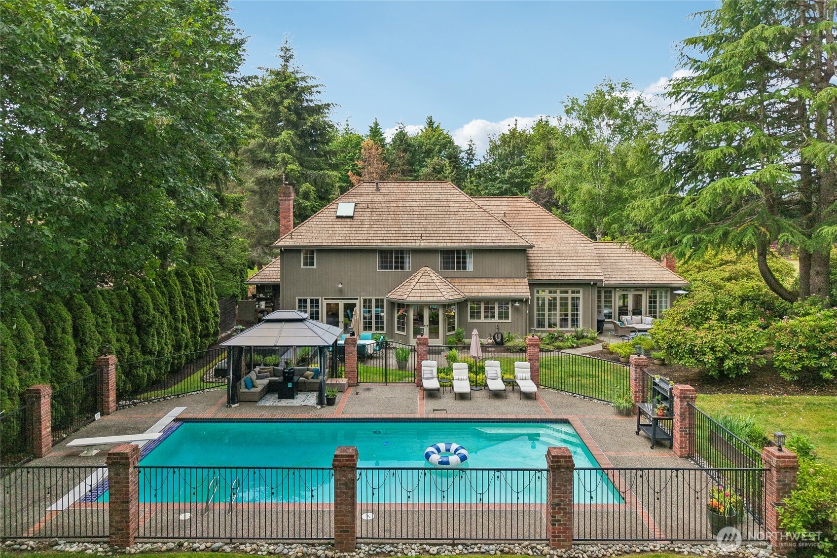 Gated large pool right off the family room just in time for summer!