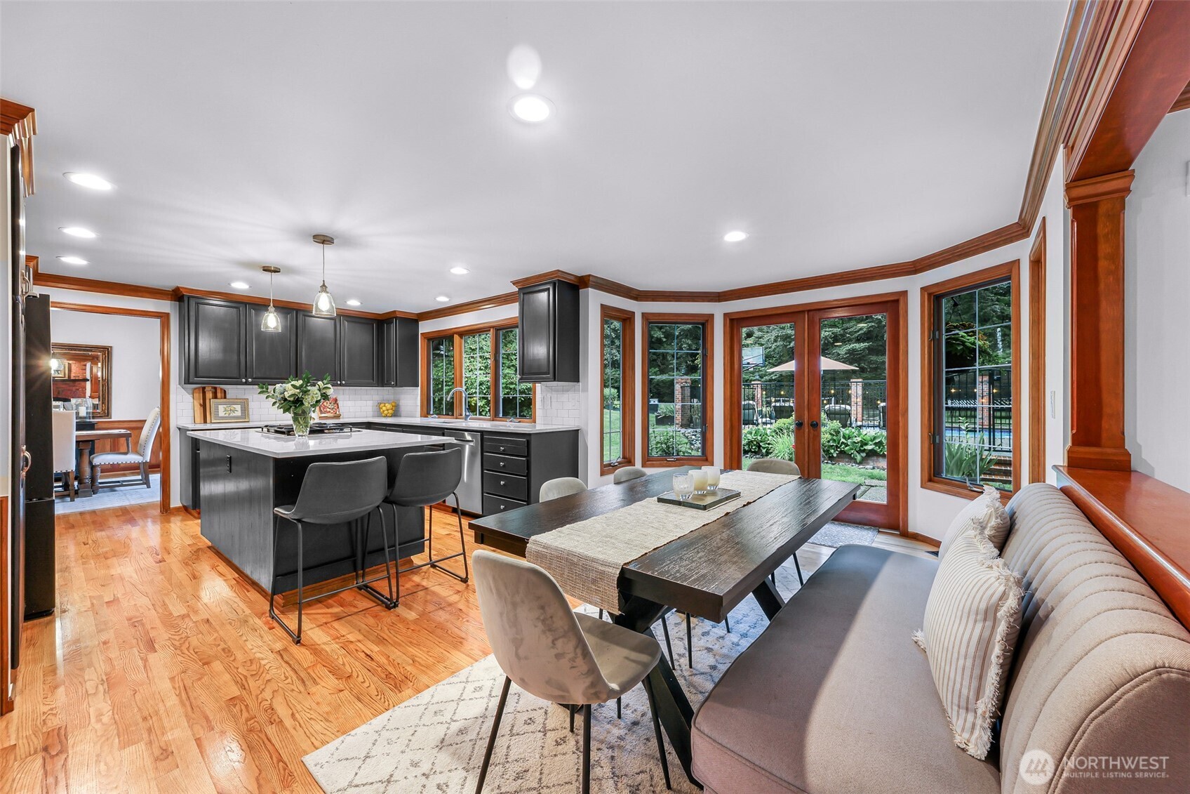 Eat in kitchen dining leading to backyard and family room.