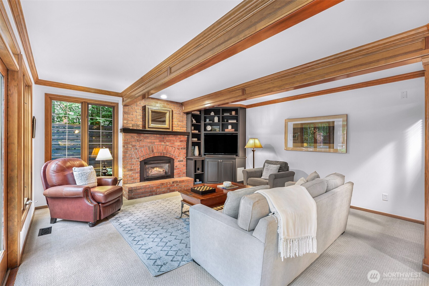 Family room off of the kitchen with gas fireplace.