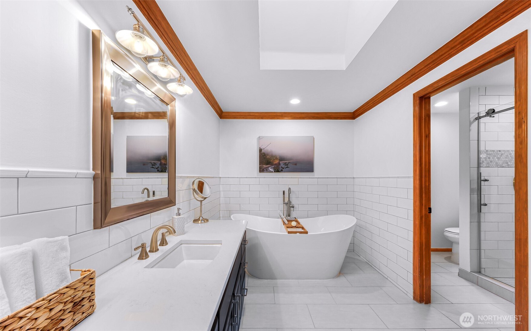 Spa inspired primary bath with soaking tub and tiled shower.