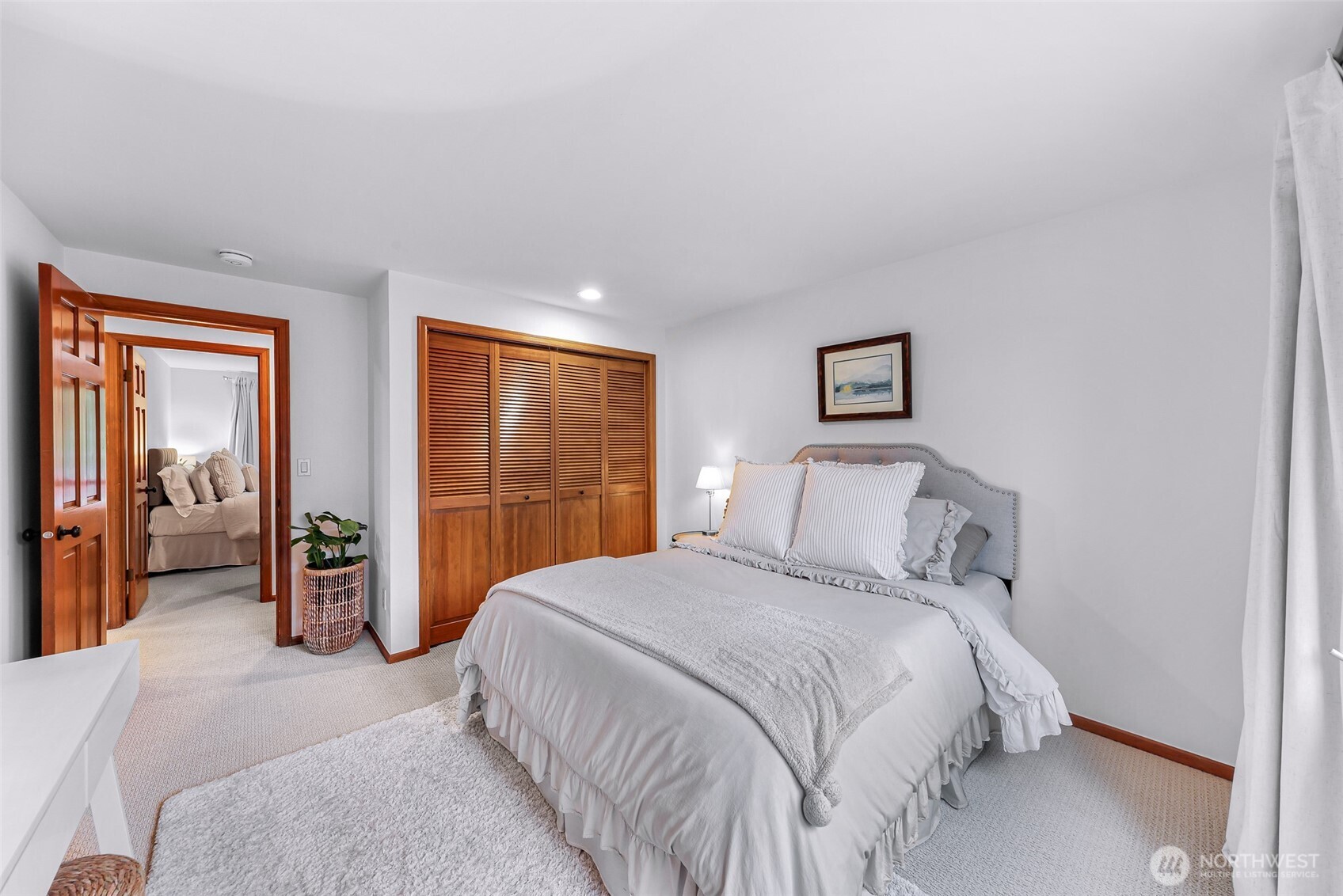 One of the three upstairs bedrooms looking to the backyard.