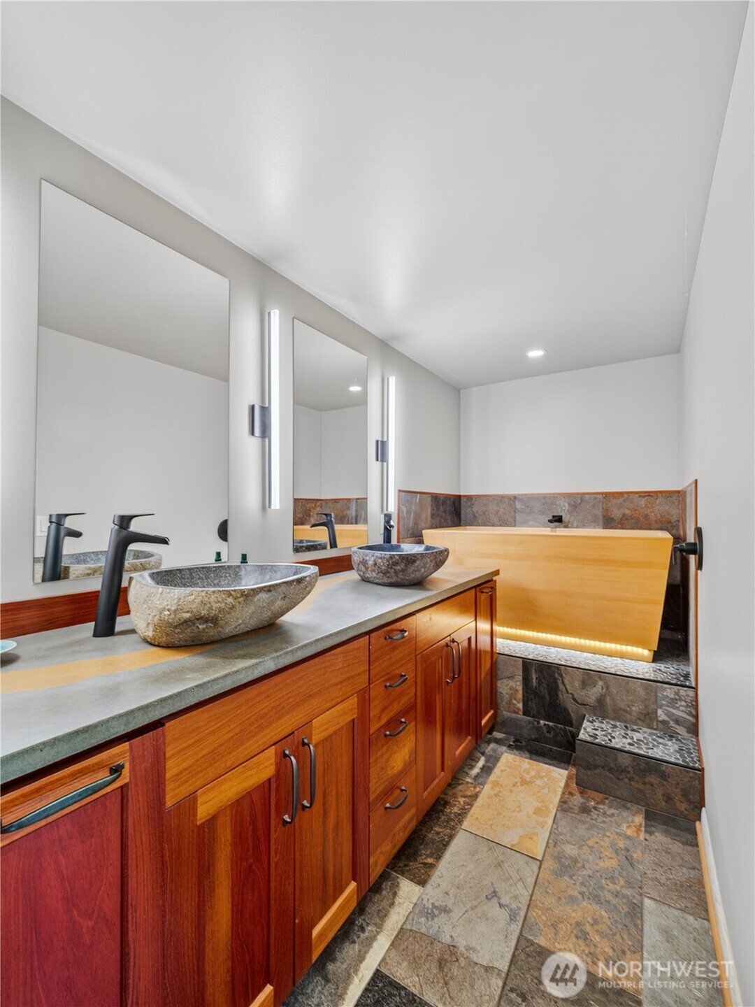 Dual sink vanity and Hinori Cypress soaking tub.