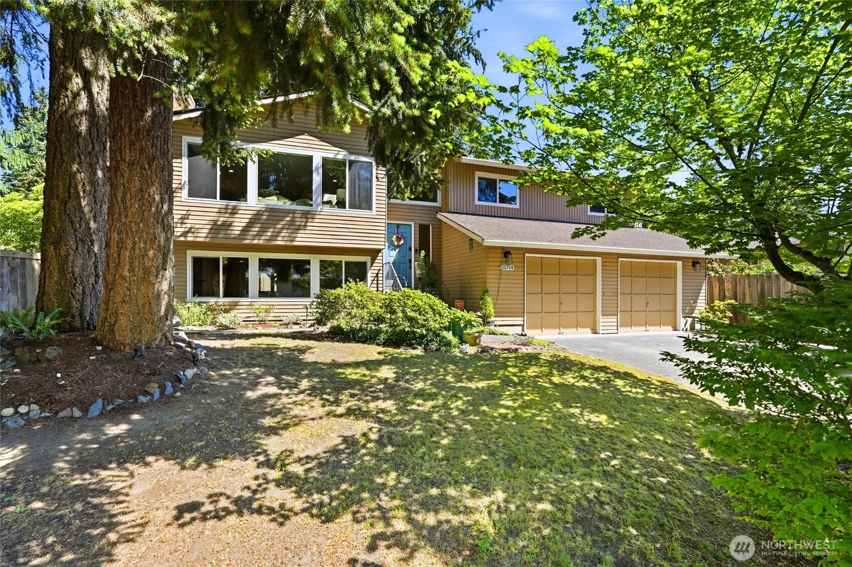 The front of the home with mature trees to offer great appeal with shade and privacy.