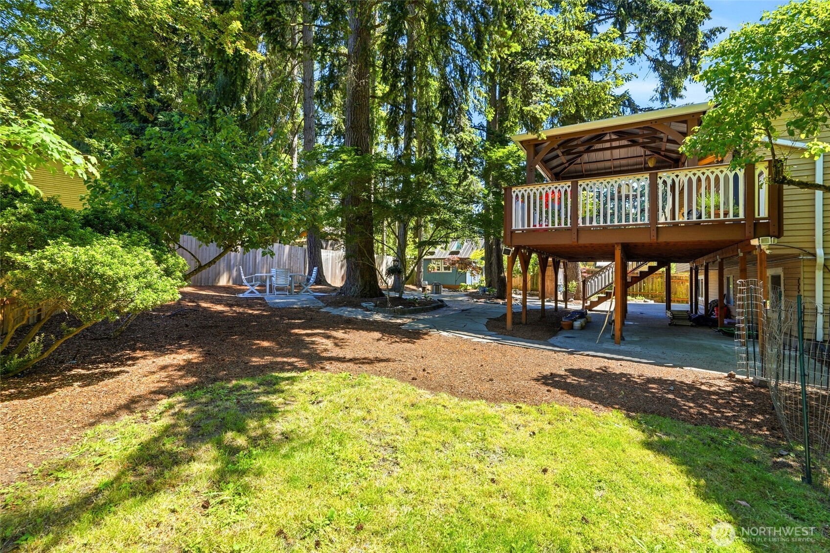 The yard continues with open grass space available for all sorts of activities.
