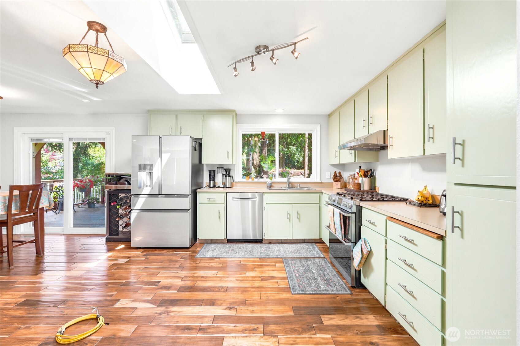 Open concept kitchen with electrical wiring for a kitchen island complete.
