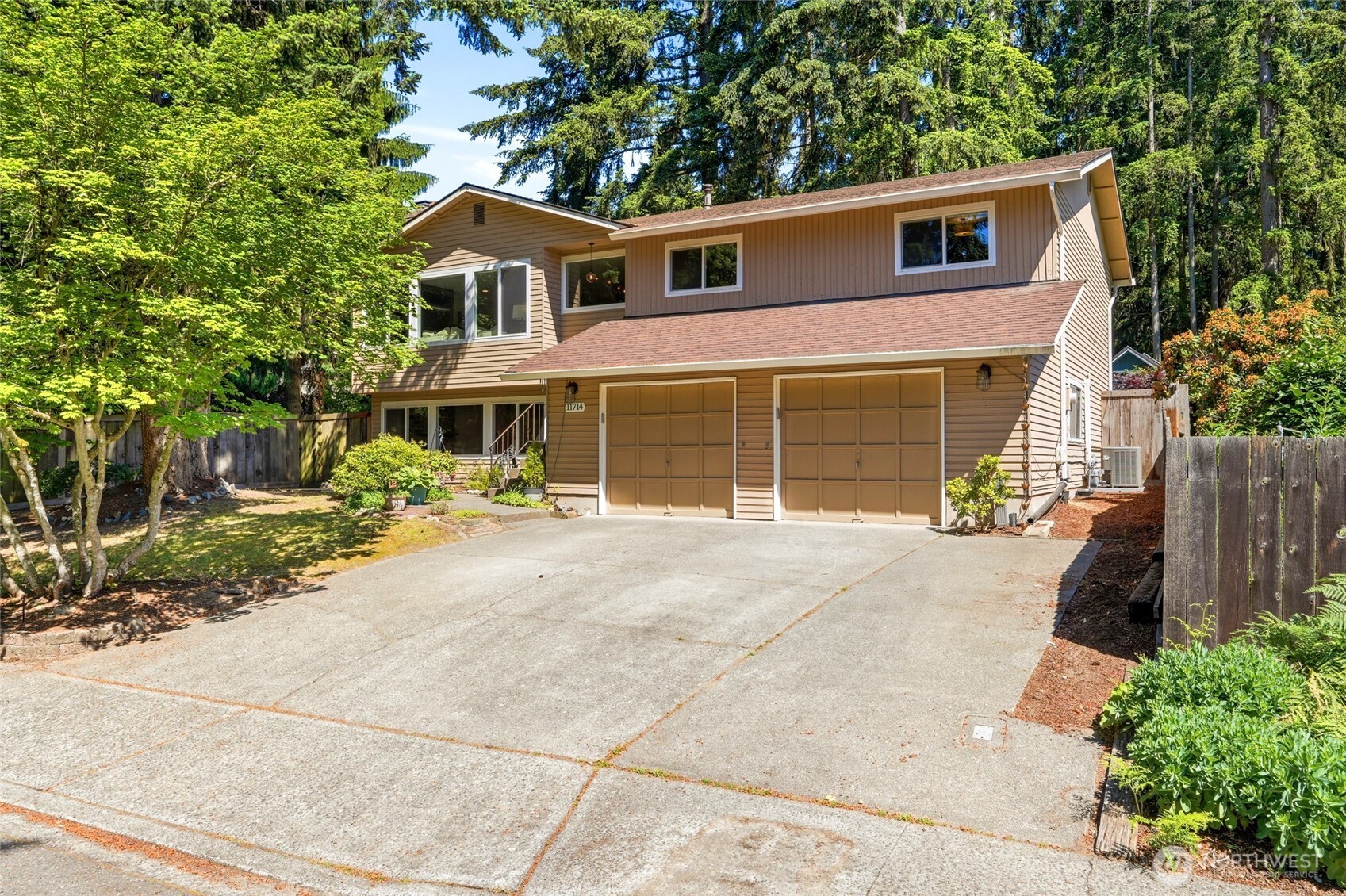 Fully two car garage with a workstation as well as ample driveway and street parking.