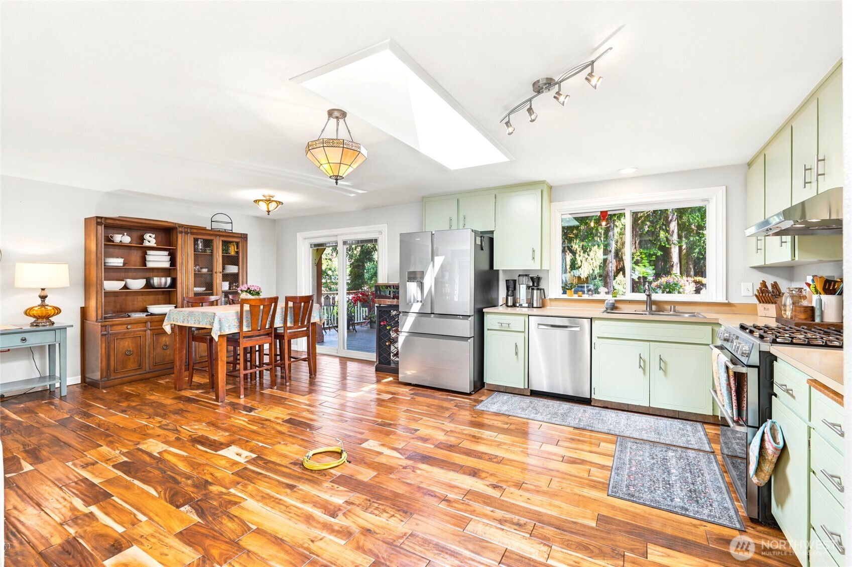 Open concept living flows from kitchen to dining.