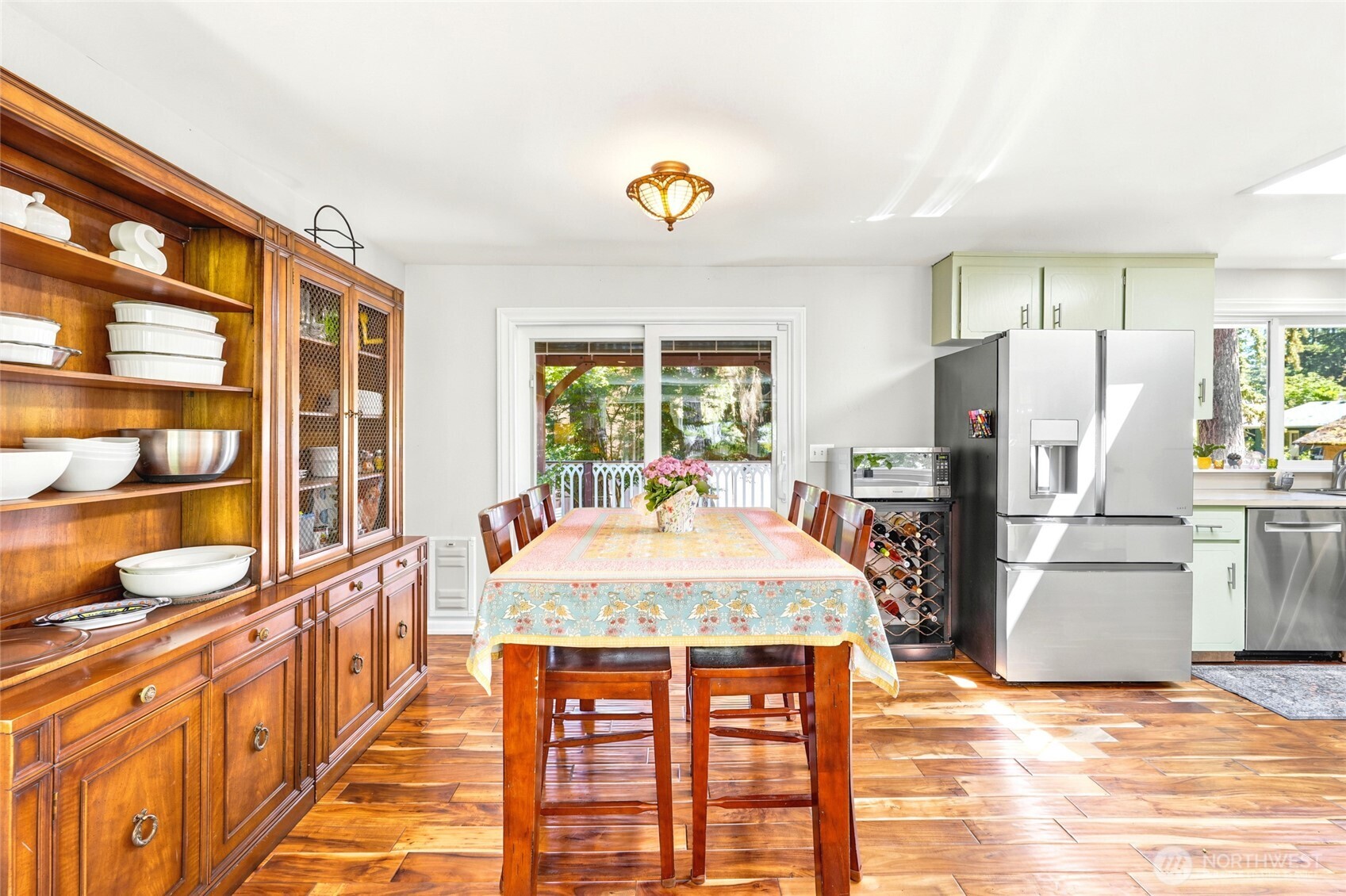 Dining room leads to updated deck and beautiful yard.