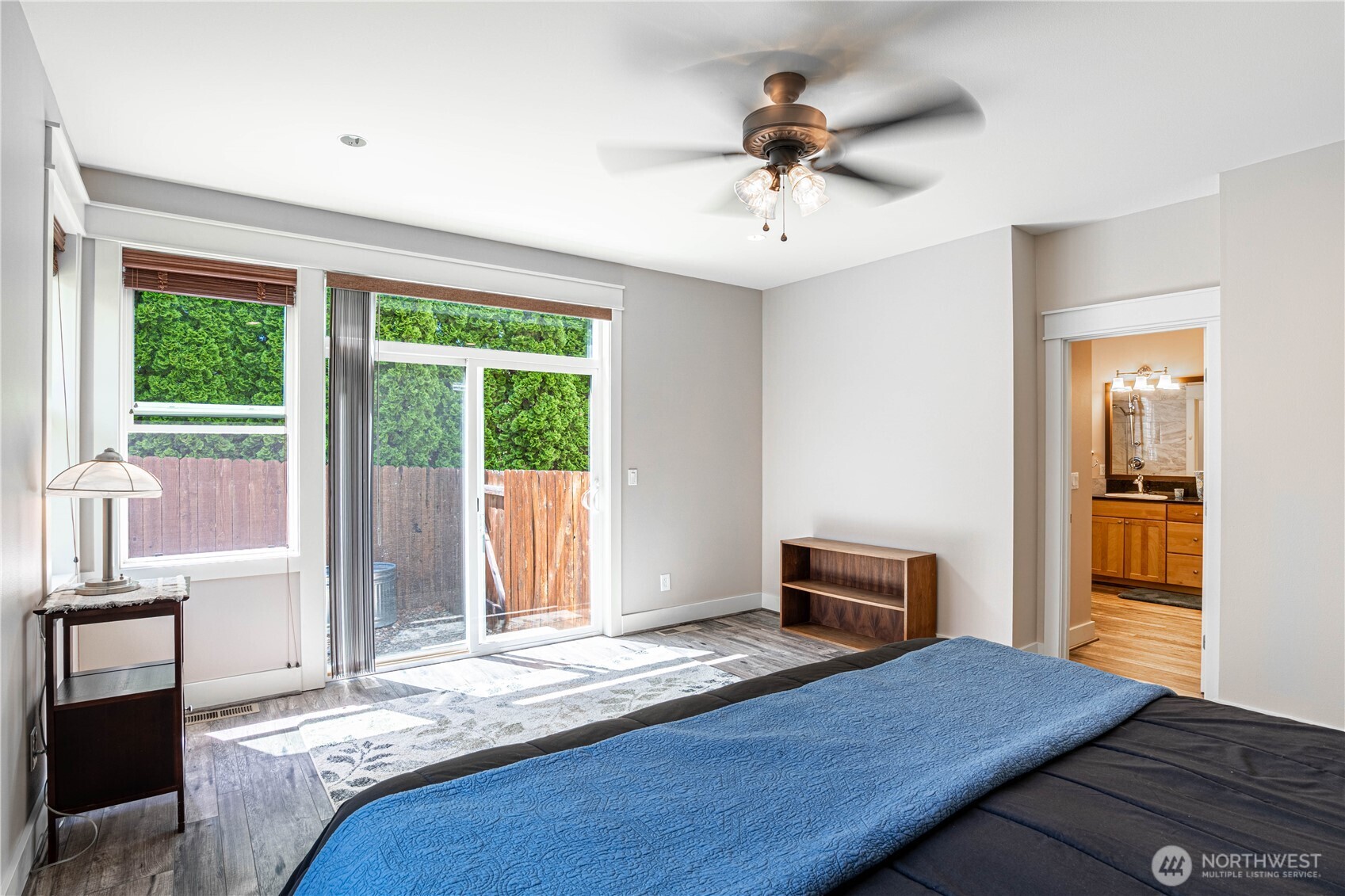 Primary bedroom with slider to back patio