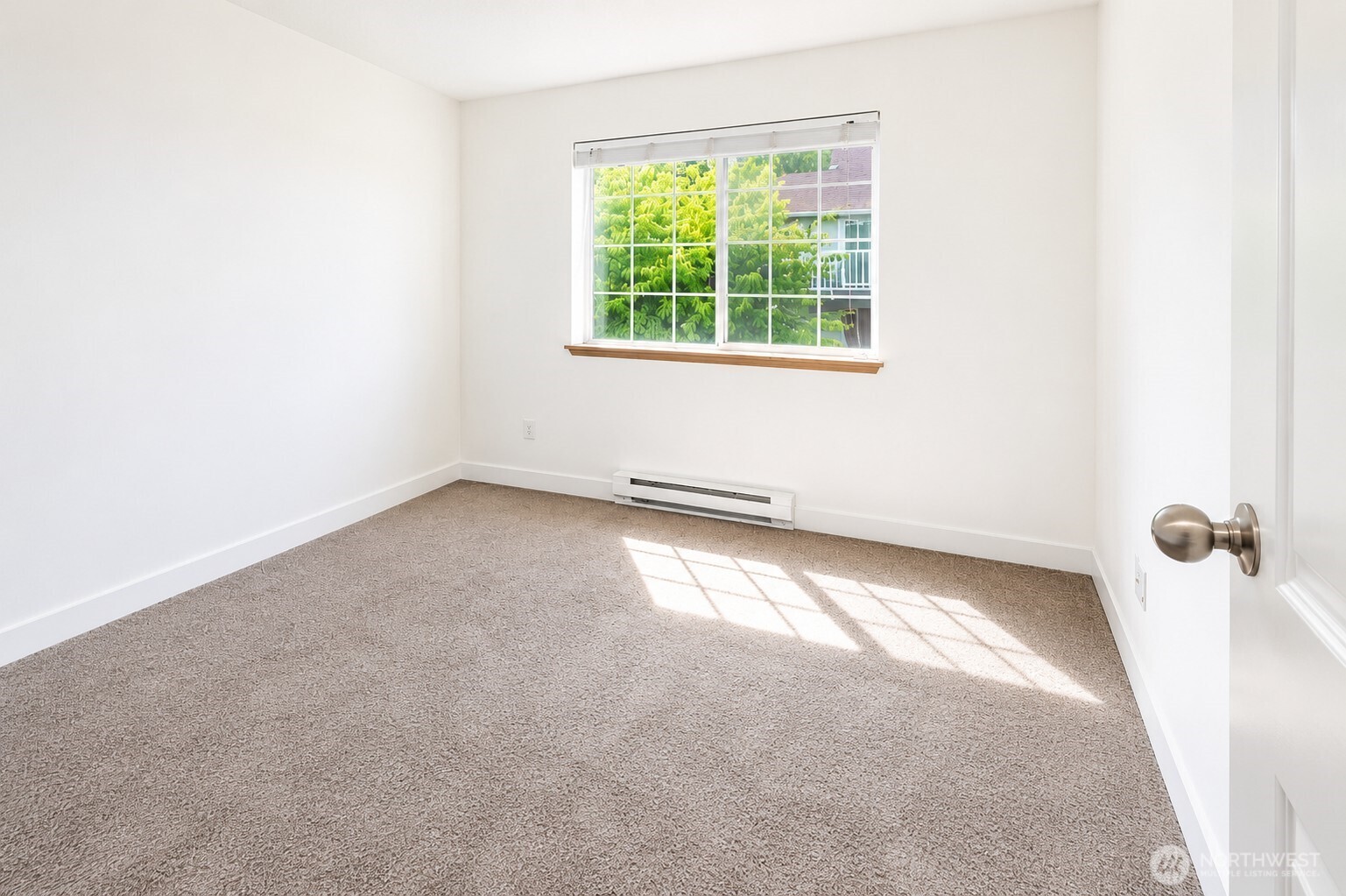the guest bedroom with brand new carpet throughout