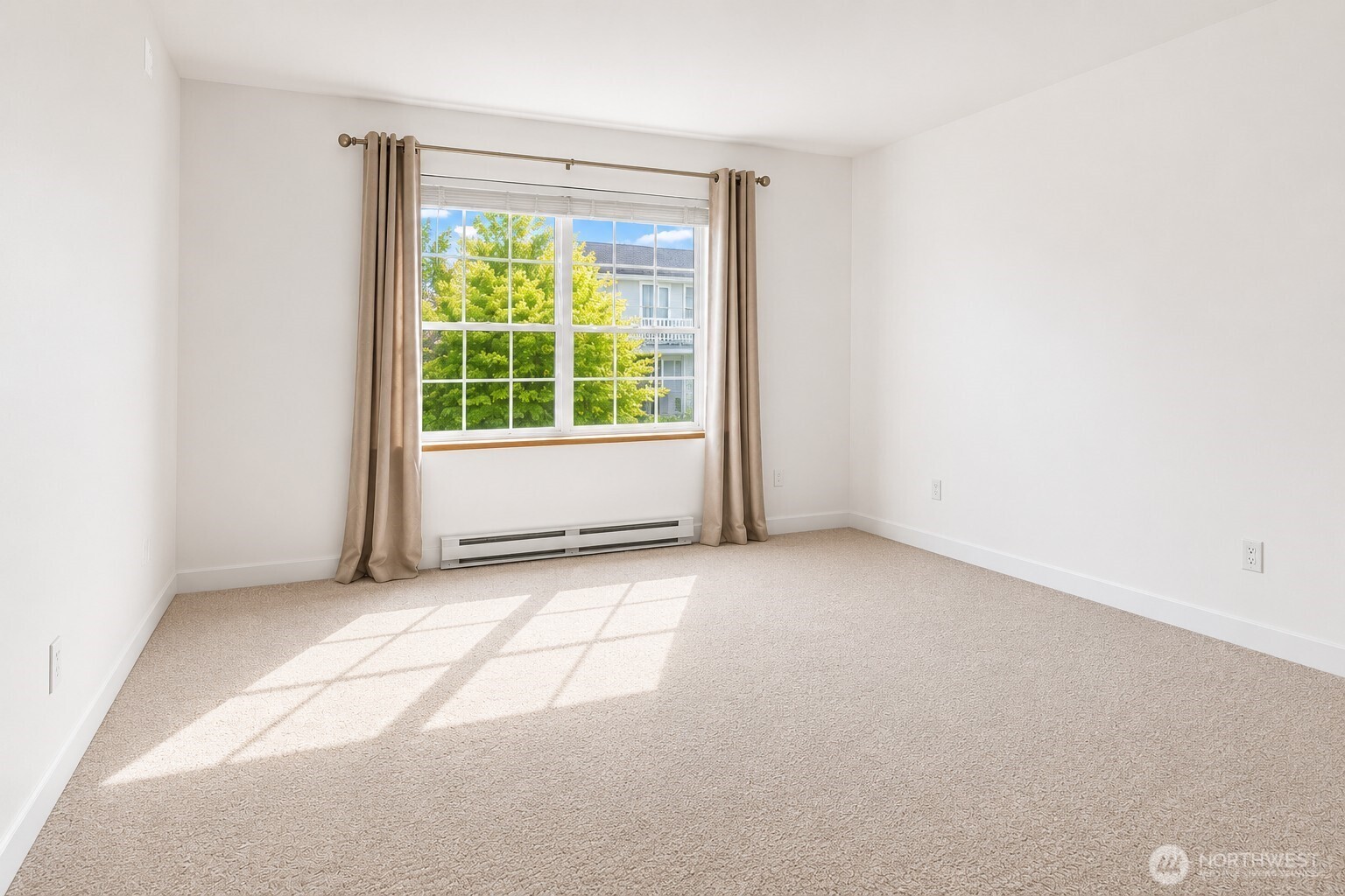 Retreat to the spacious primary bedroom with brand new carpet throughout
