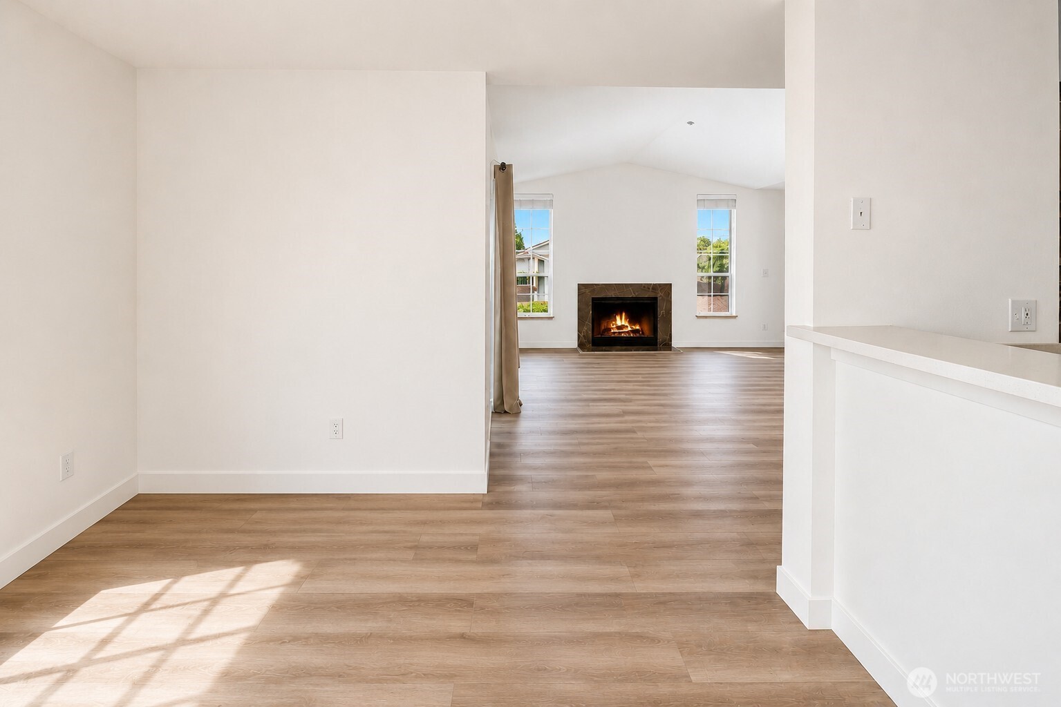 New luxury LVP flooring and new vinyl sliding doors enhance the home's modern appeal.