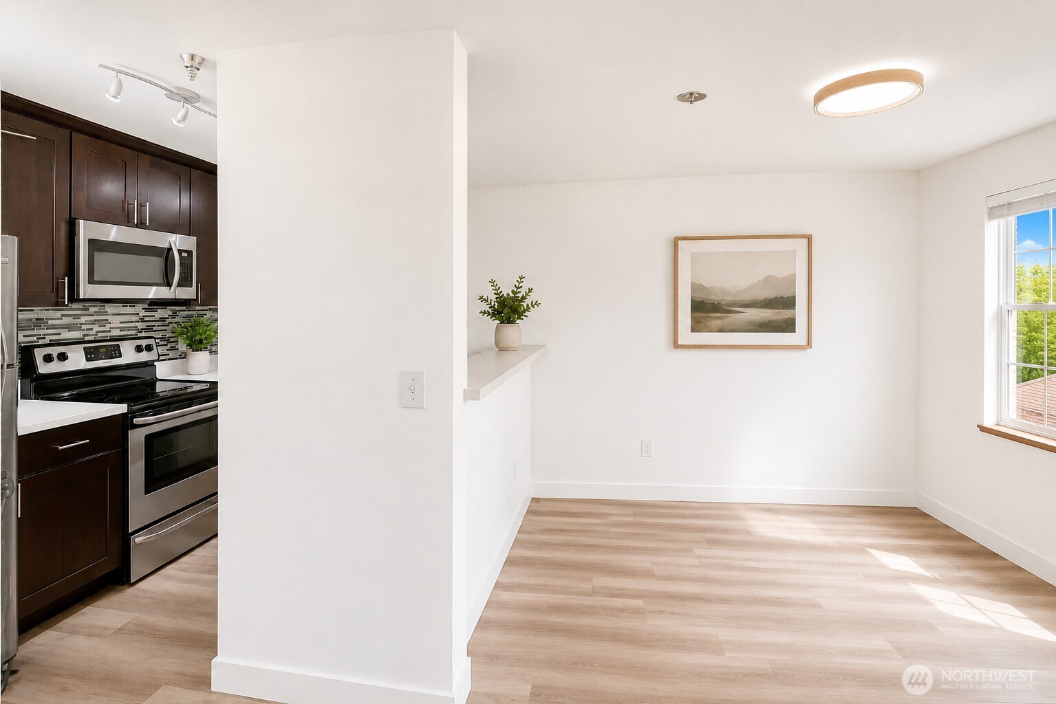 A bright dining area with a generously sized window.