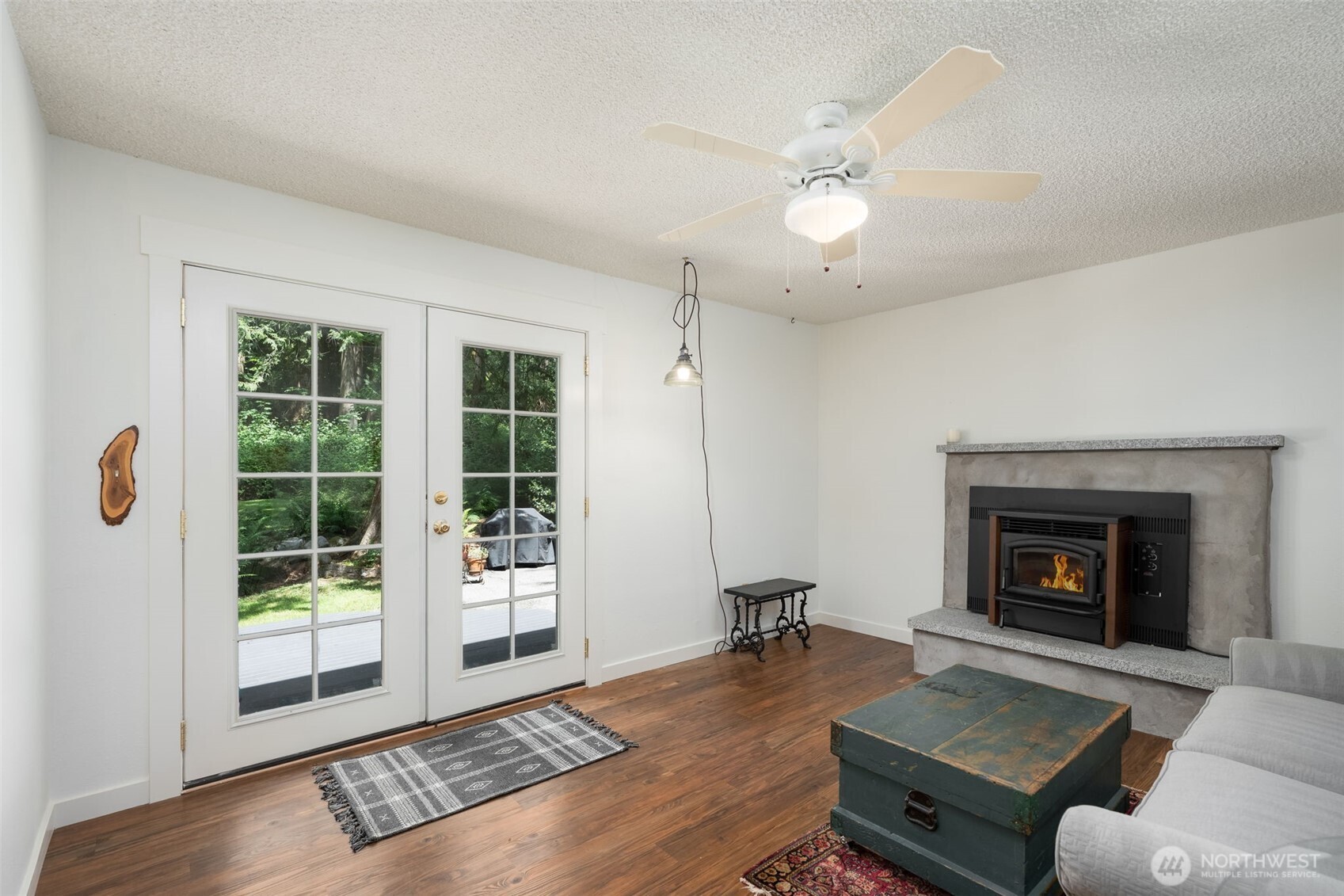 The den is a great place to have a home office or craft space or anything you like. This also opens to the back deck. A pellet stove keeps the entire home warm during those cool winter evenings.