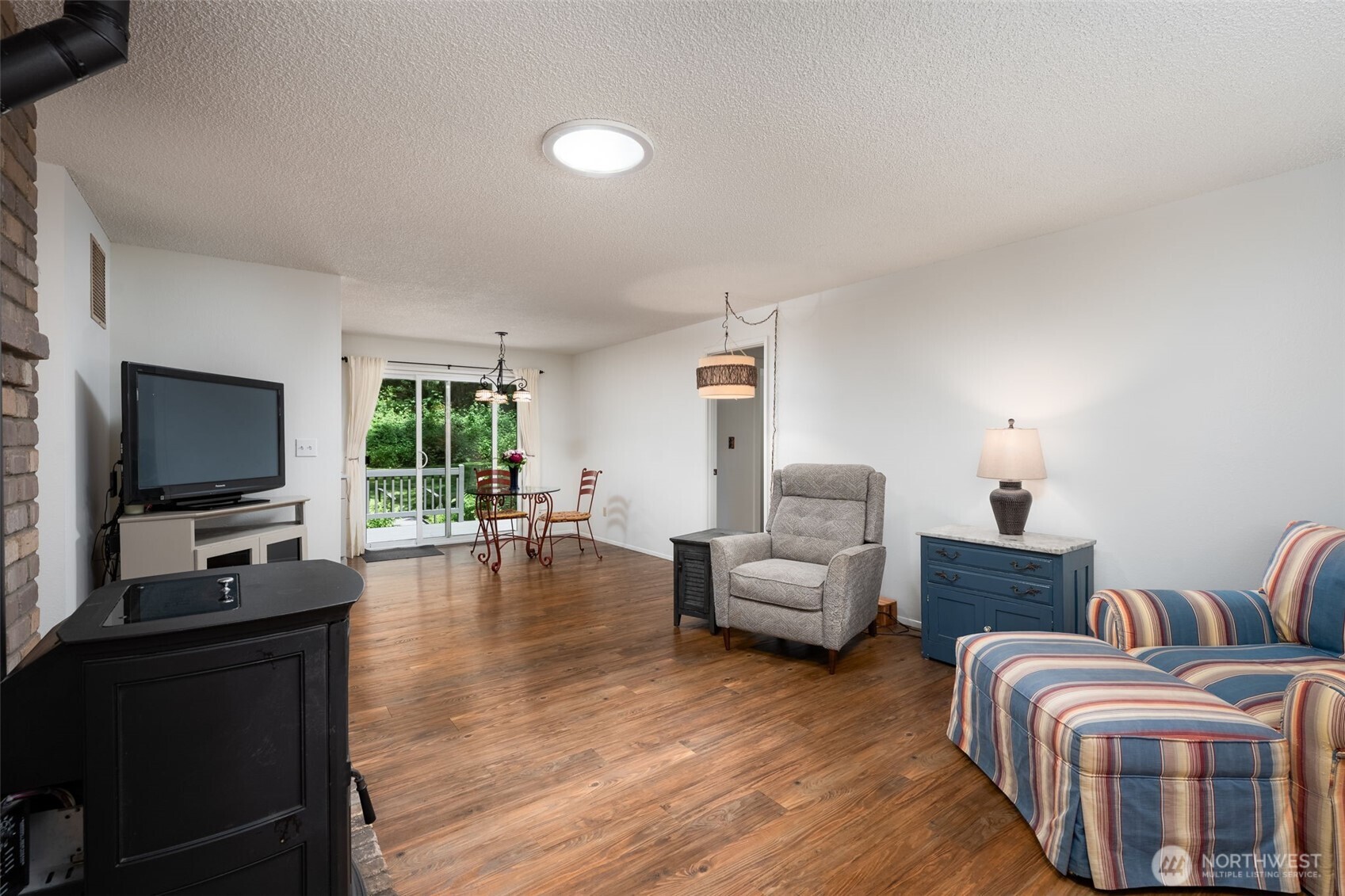 As you enter you will be in your living room which flows nicely into the dining room and remodeled kitchen. Easy access to your backyard and deck. There is also a pellet stove in this living room.