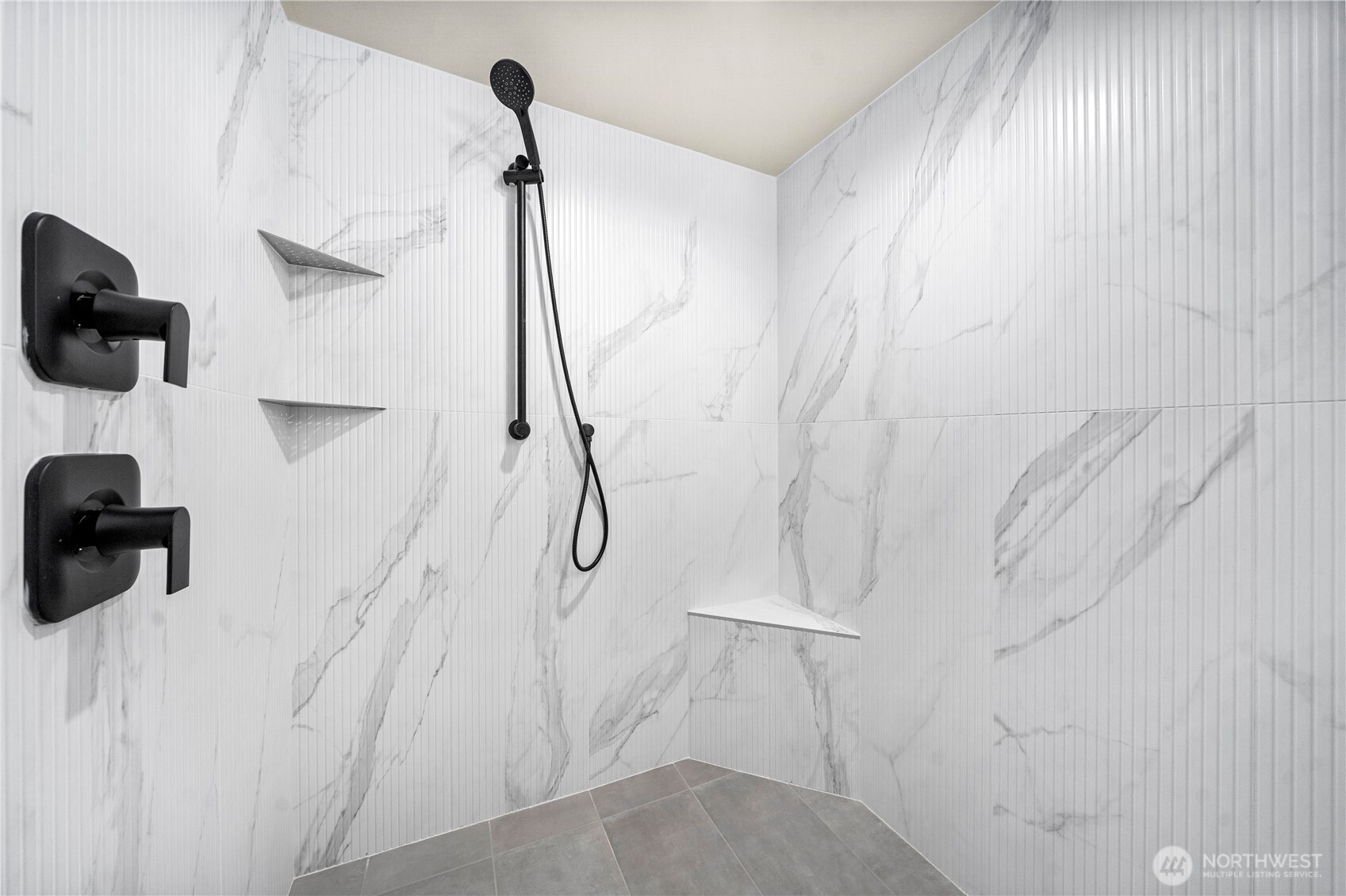 Oversized shower with bench-recirculating hot water for immediate showers