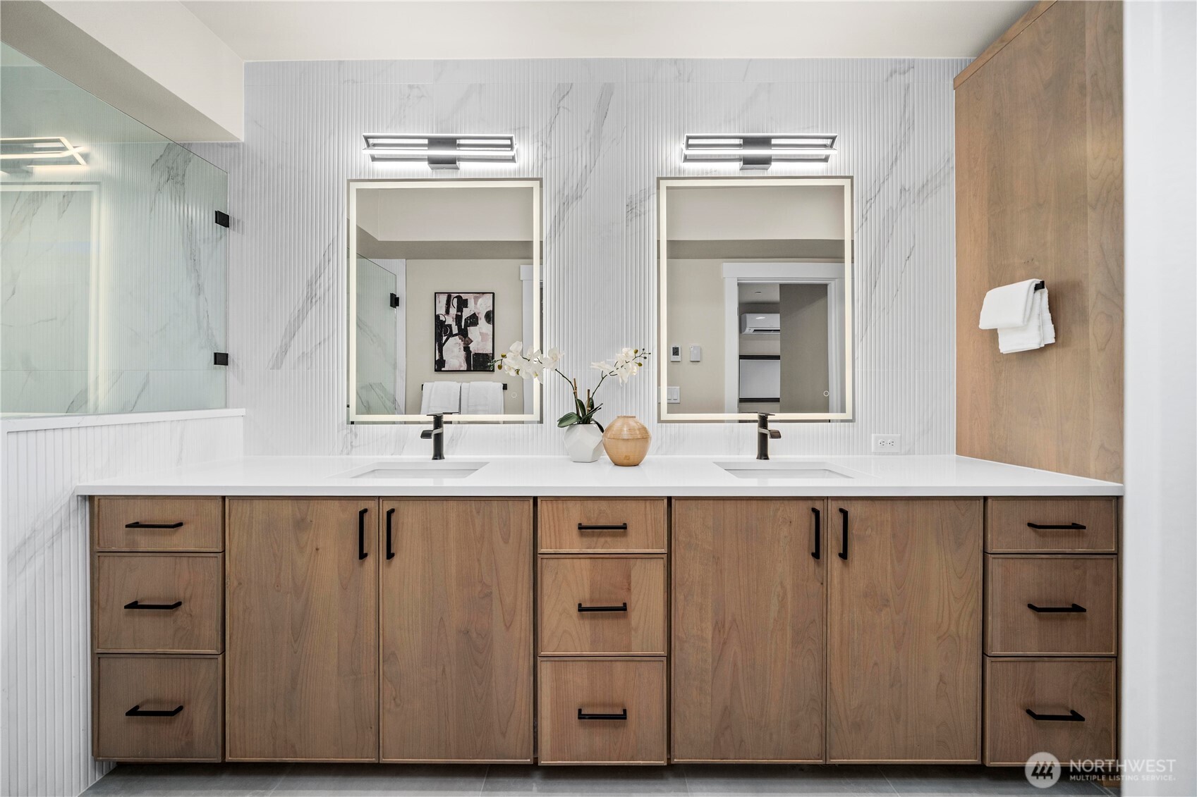 Double vanity with linen closet and laundry pullout