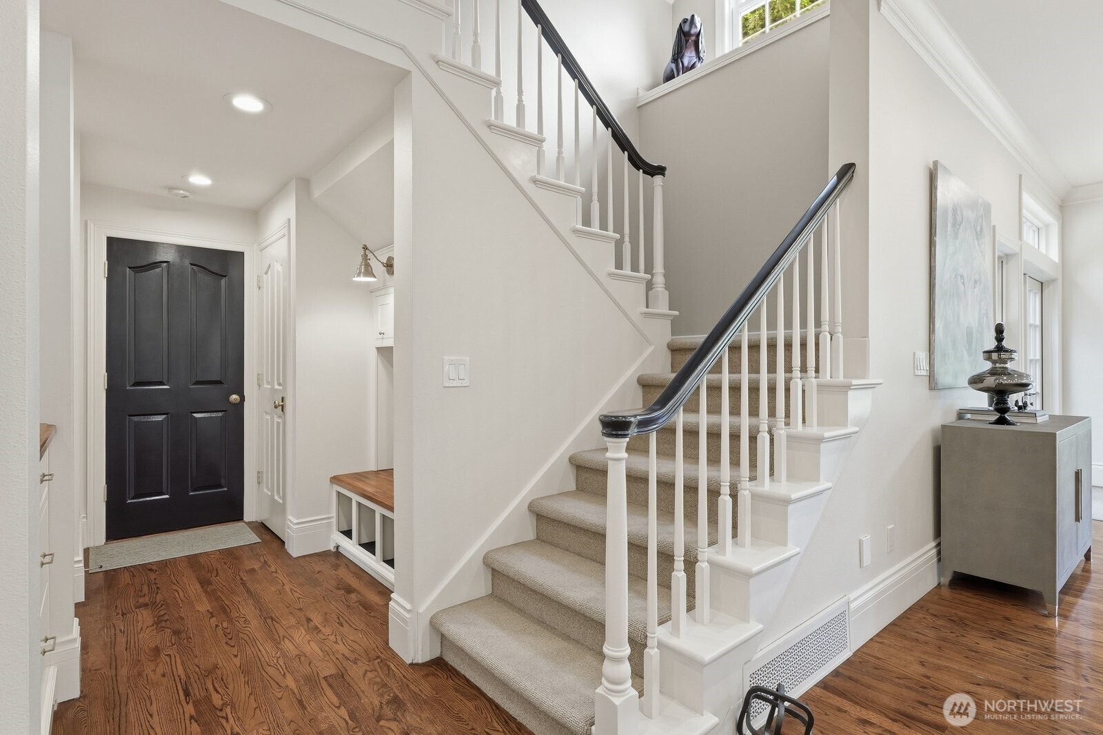Off the kitchen near the rear stairway is the mud room with lots of built-in cabinetry and the 2nd half bathroom.