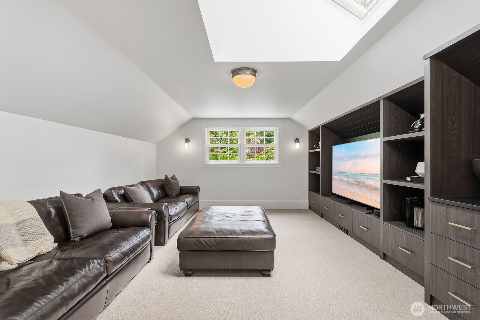 Dual staircases lead to the upper level, where five additional rooms offer remarkable flexibility for guest accommodations, home offices or fitness spaces. Bonus room with built-in cabinetry and beverage fridge.
