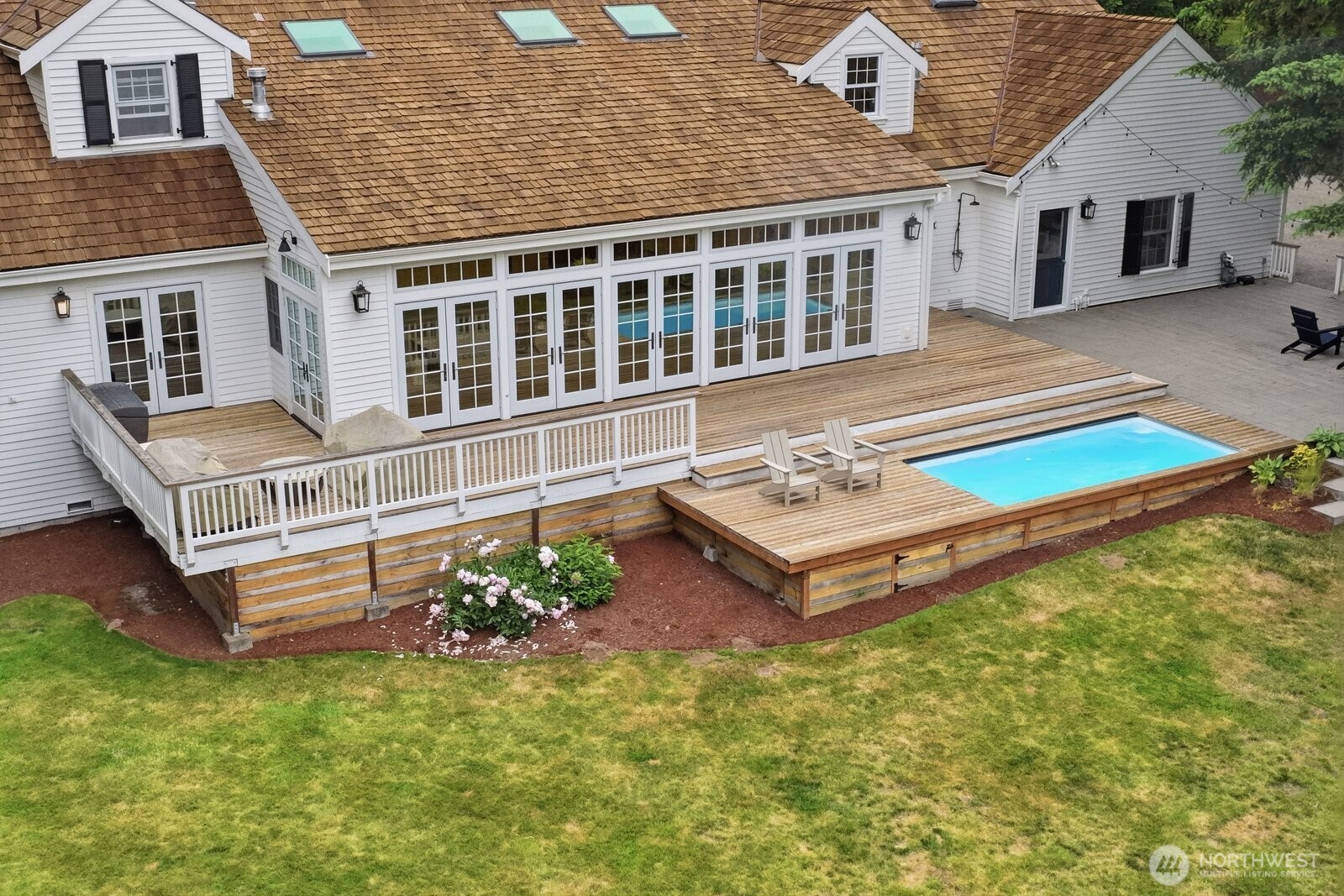 The 1.22 acre lot boasts a newer extensive natural cedar deck.