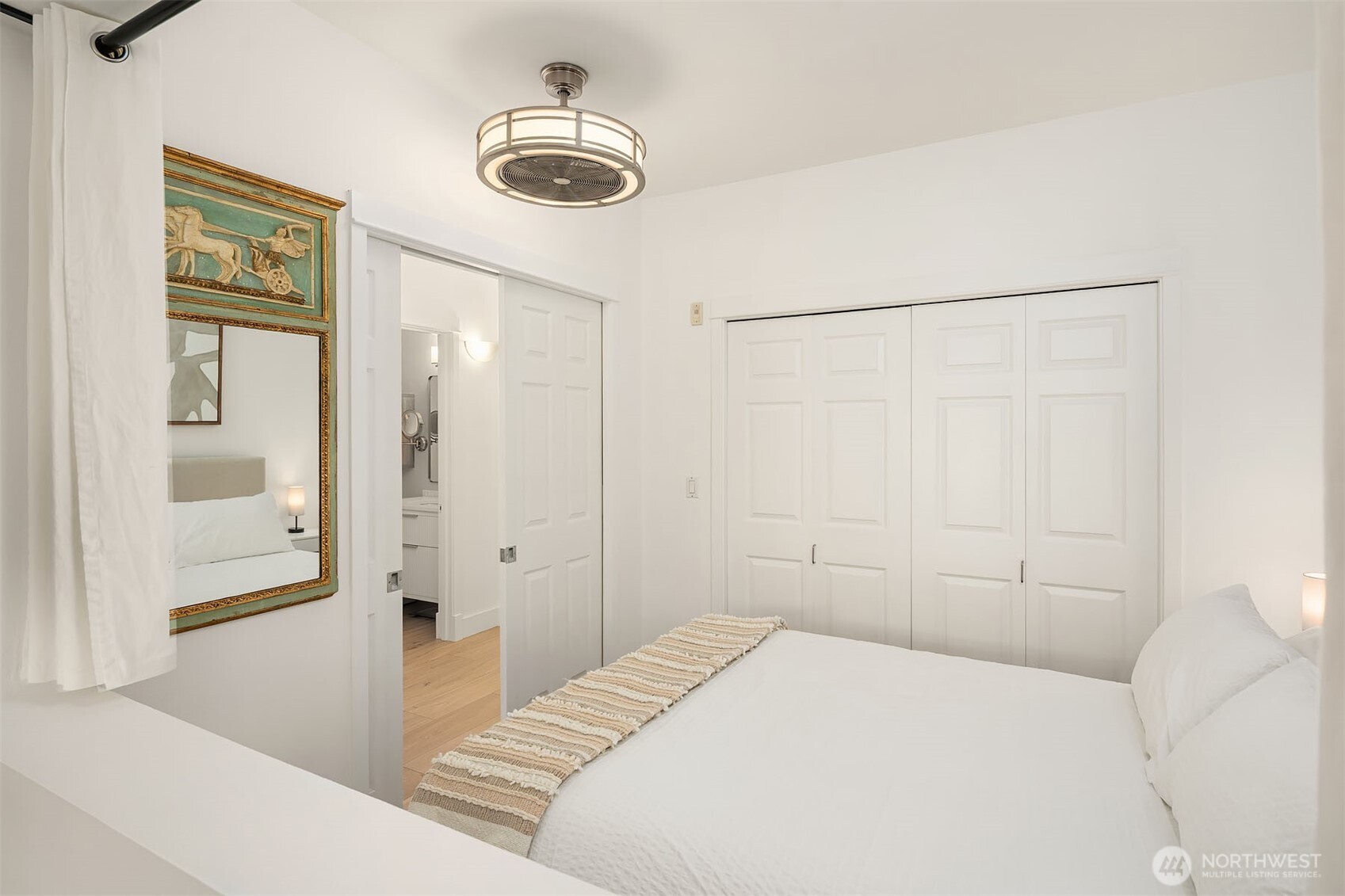 Bedroom alcove is conveniently located near bathroom and additional closet