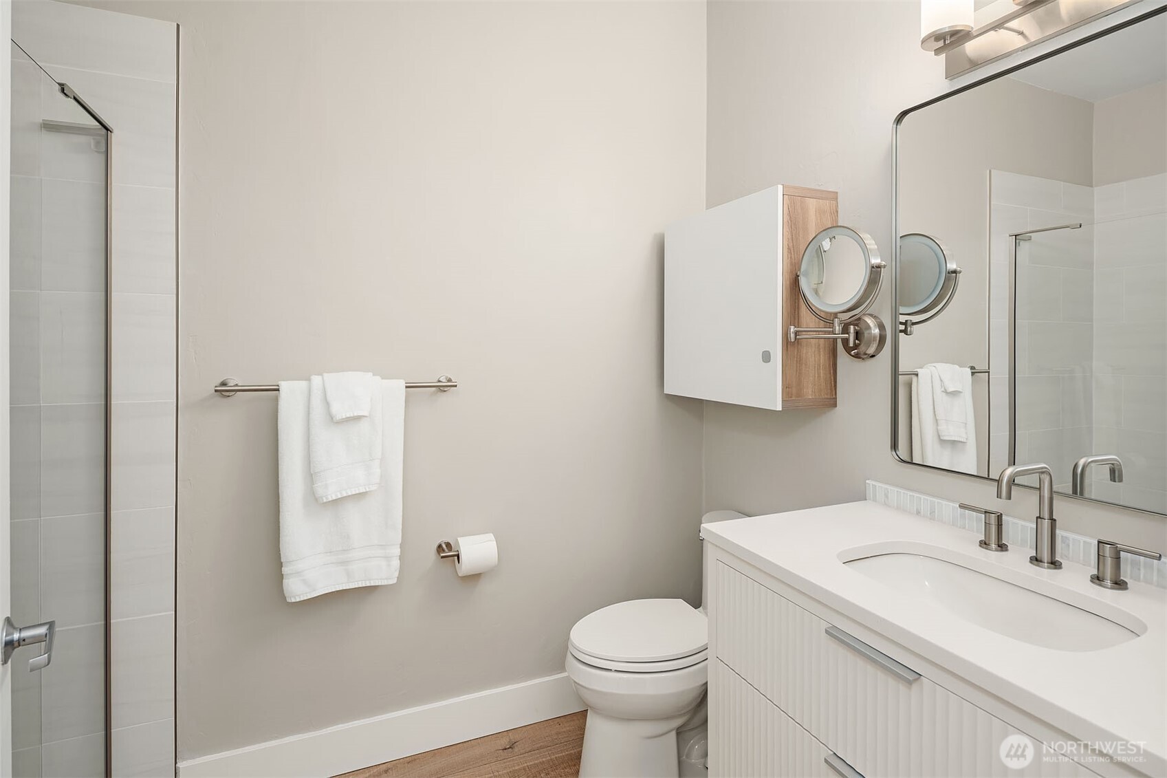 Updated bathroom with larger shower and contemporary floating vanity