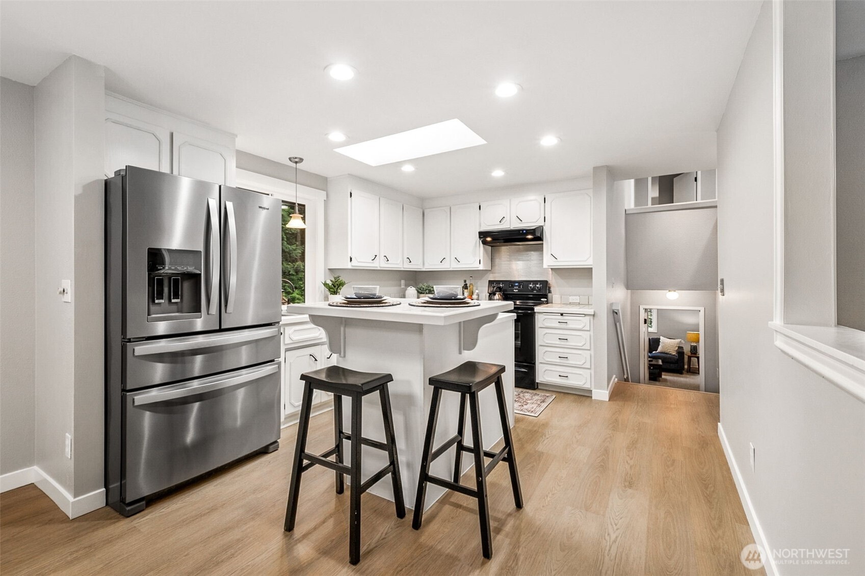 Dining room could support a 6 person table easily, and cute window seat is a comfy spot to enjoy! Several skylights throughout the home let in a ton of light!