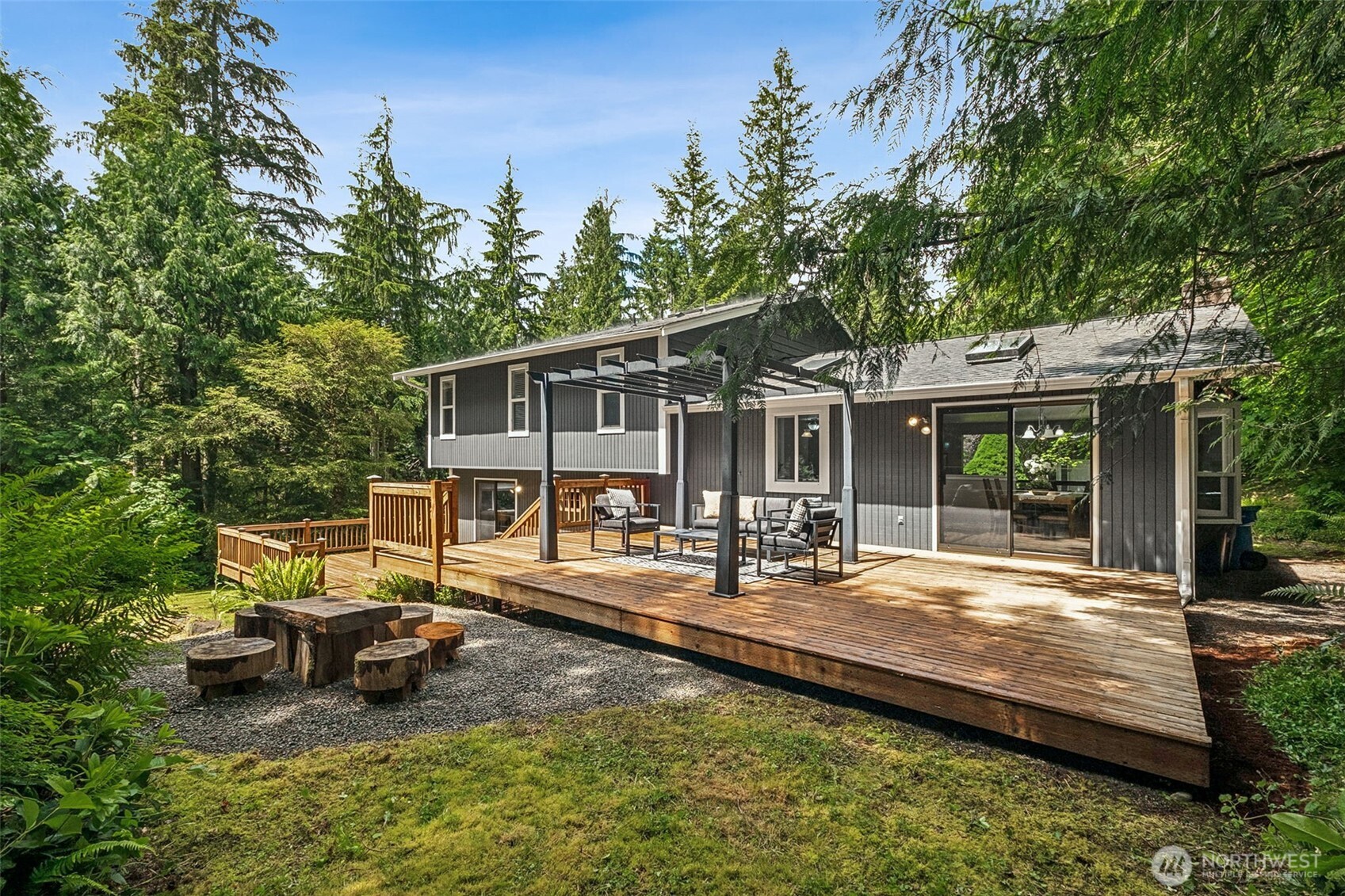 Large back deck is freshly cleaned and ready for summer fun! Add a top of some kind to this metal gazebo for covered eating space. Just steps down to the large flat back yard.