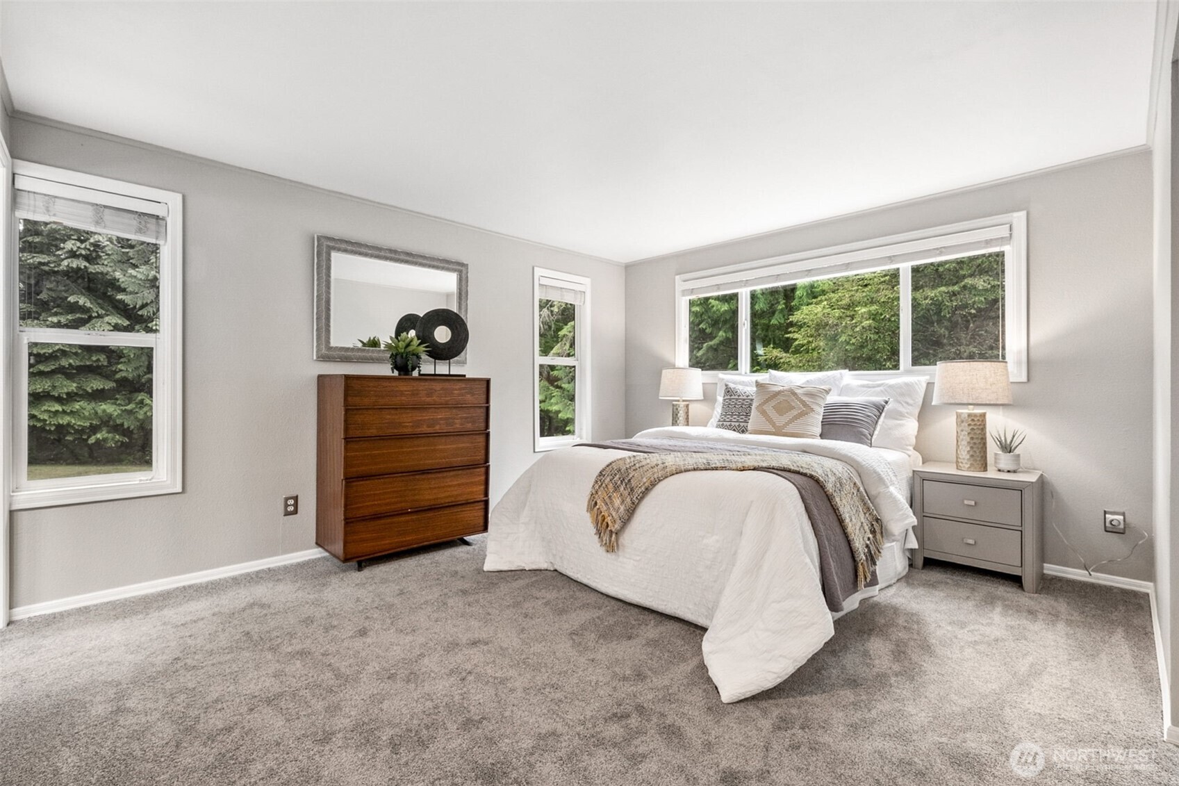 Large area at the top of the half stairs leading to the second level is flooded with light from the skylight, and contains enough space for a small desk or other use of this space. New carpet and new paint make it all shine like new!