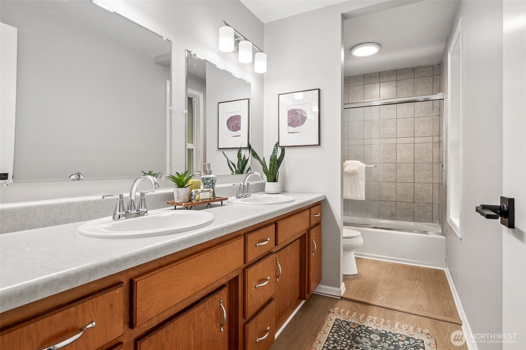 Primary suite is oversized, with two full closets and attached full bath. Several windows let in plenty of light!