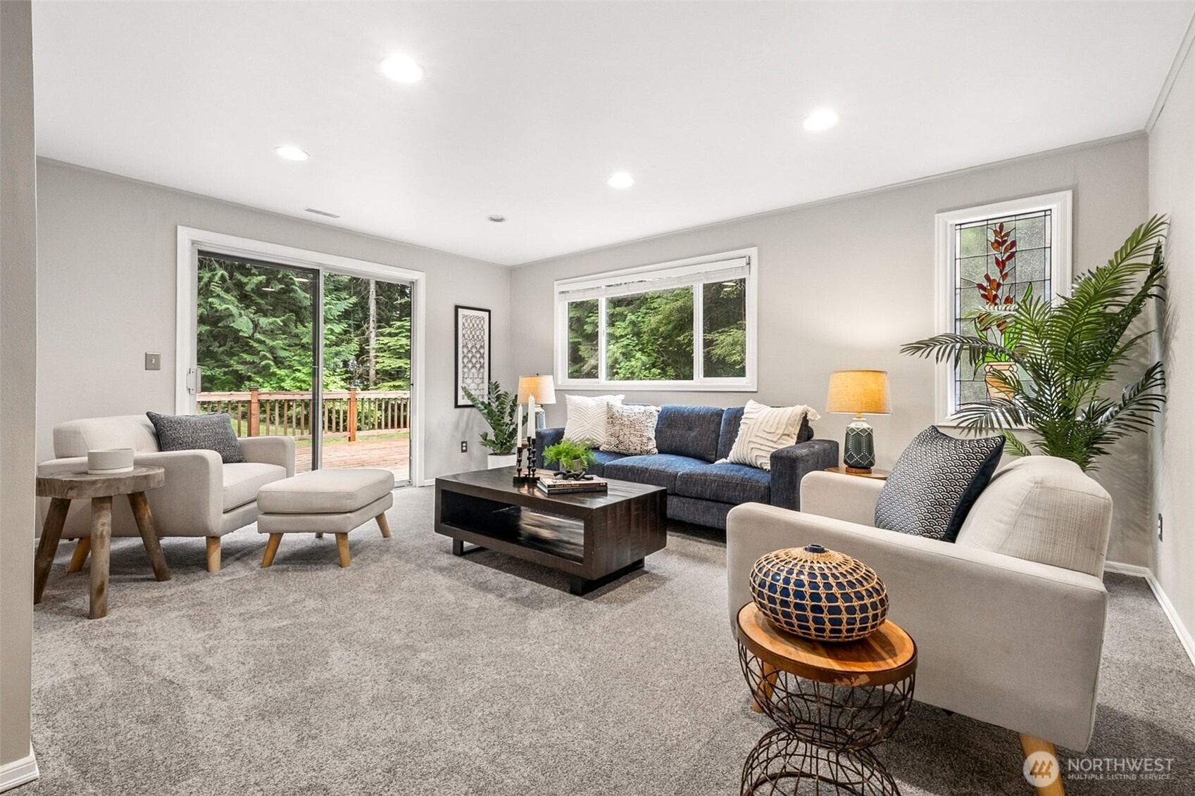 The lower level offers a large family room with sliding doors leading directly to the backyard and lower deck, creating easy indoor-outdoor flow. New carpet, new paint, newly painted doors. Extra storage under the stairs.