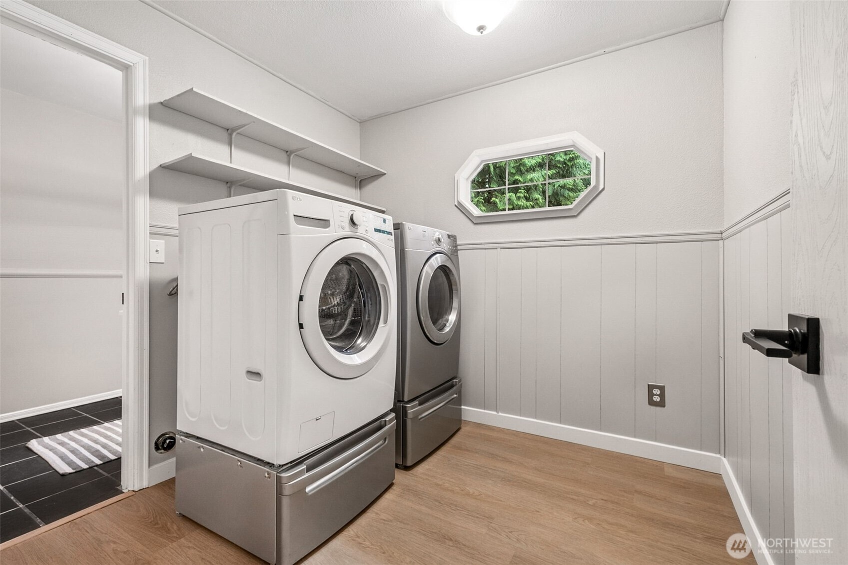 Half bath on the lower level offers additional space for both guests and regular family use. It would be possible to add a shower in this combo space of laundry room and half bath by rearranging a few things.