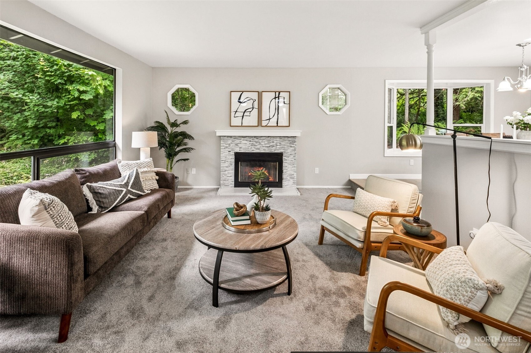 All the main level spaces are open to each other, either through a half wall, such as this one from the entry way, or a half wall in the kitchen and fully open to the dining room.