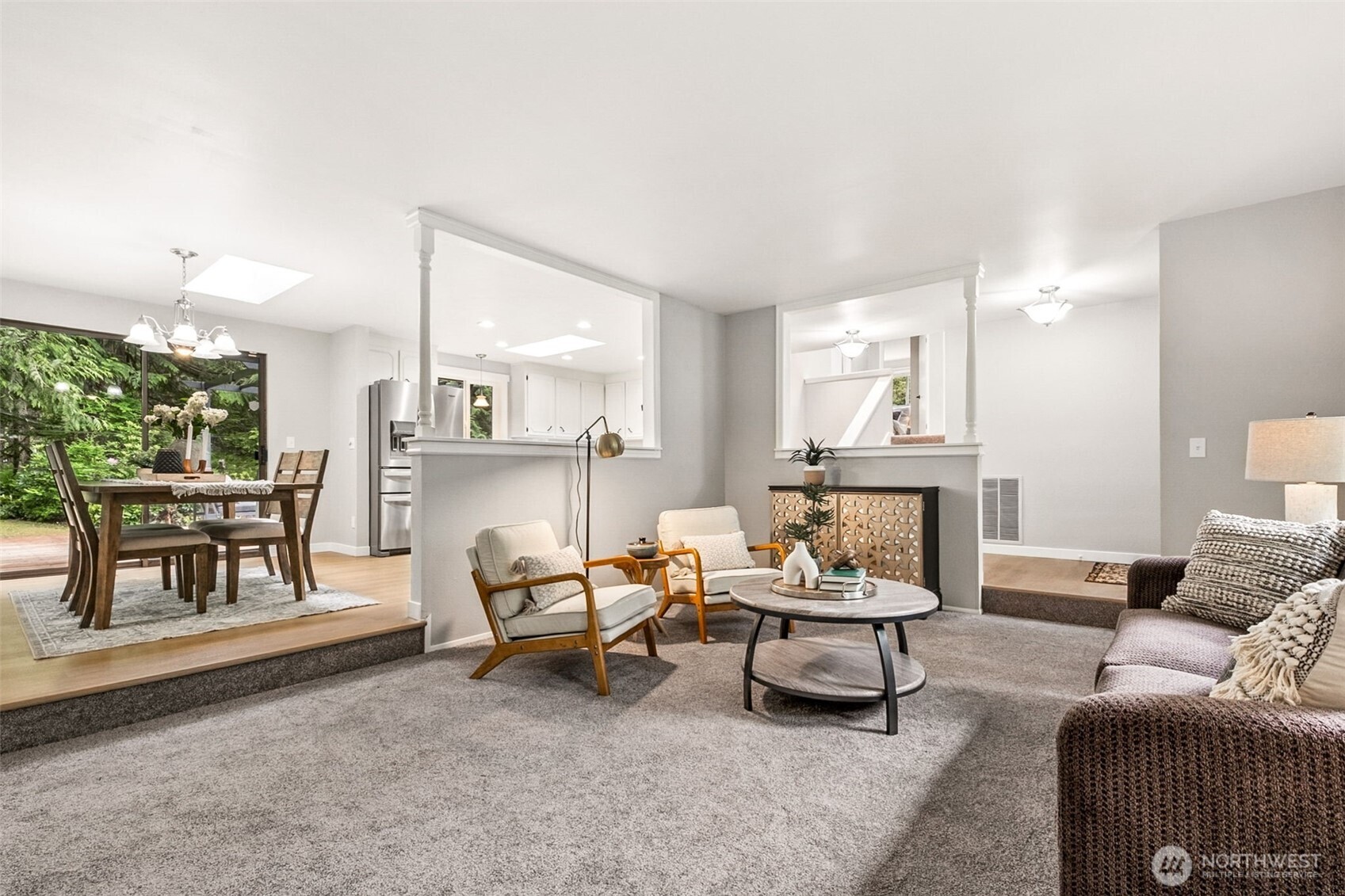 Half wall allows site lines into the living room from the kitchen to create a great entertaining hub, but with a little division of the space. This NON load bearing wall could also be completely removed if someone desires.