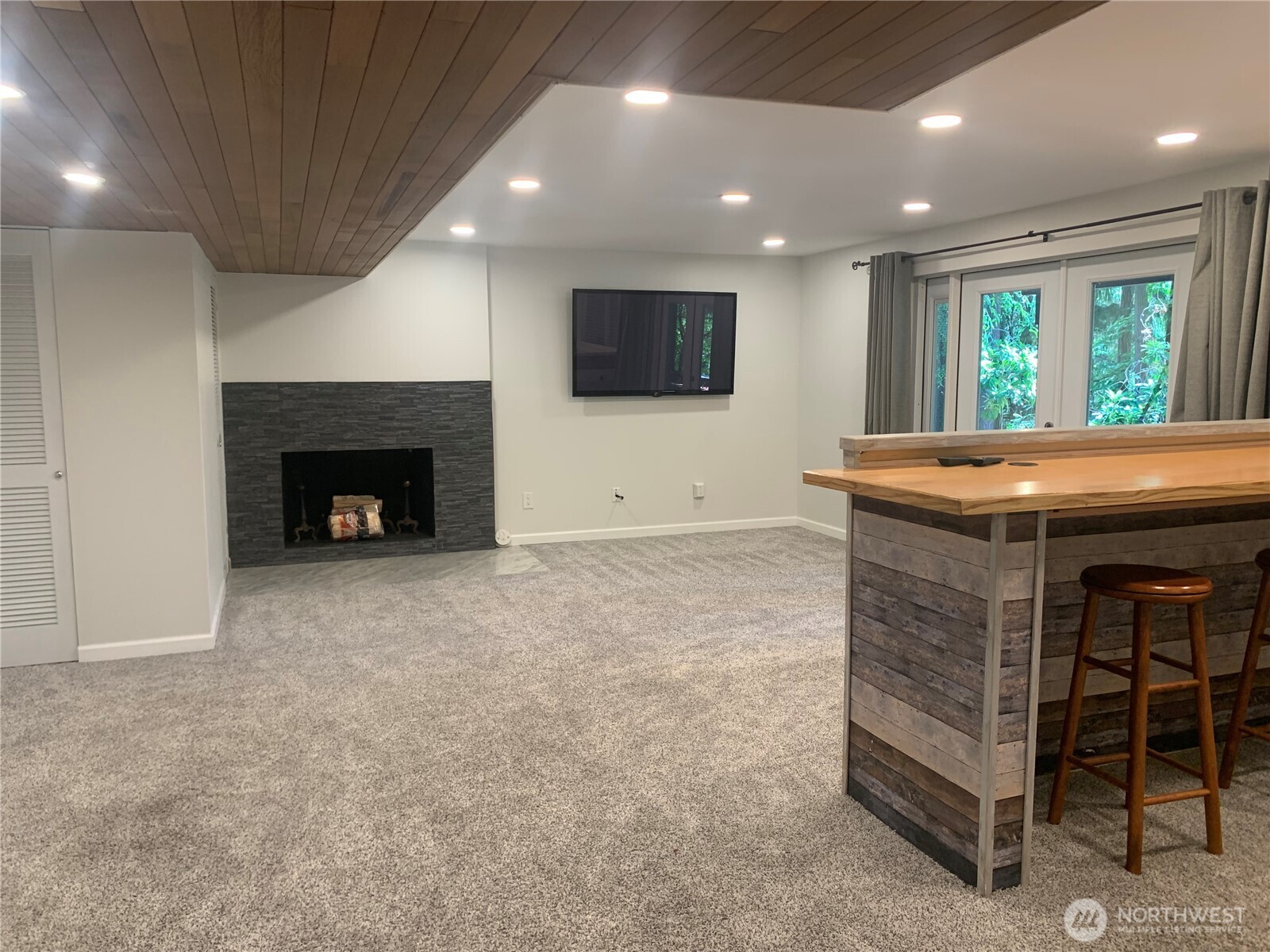Lower living room, French doors & fireplace