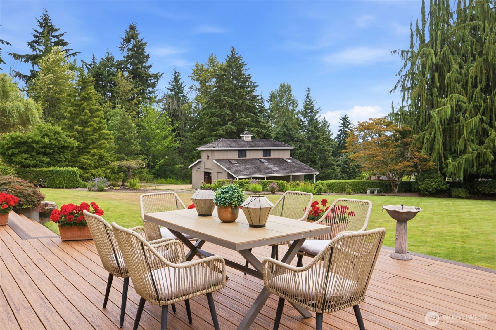 Trex deck overlooks the barn and landscaped yard.