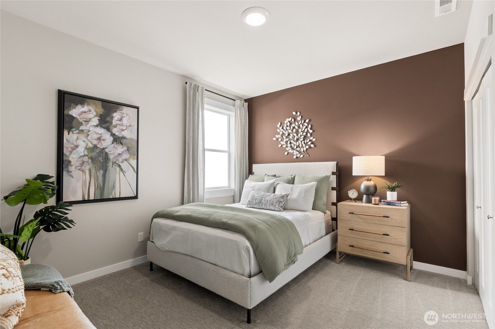 Spacious main floor bedroom fits comfortably fits a Queen-sized bed with room to spare!