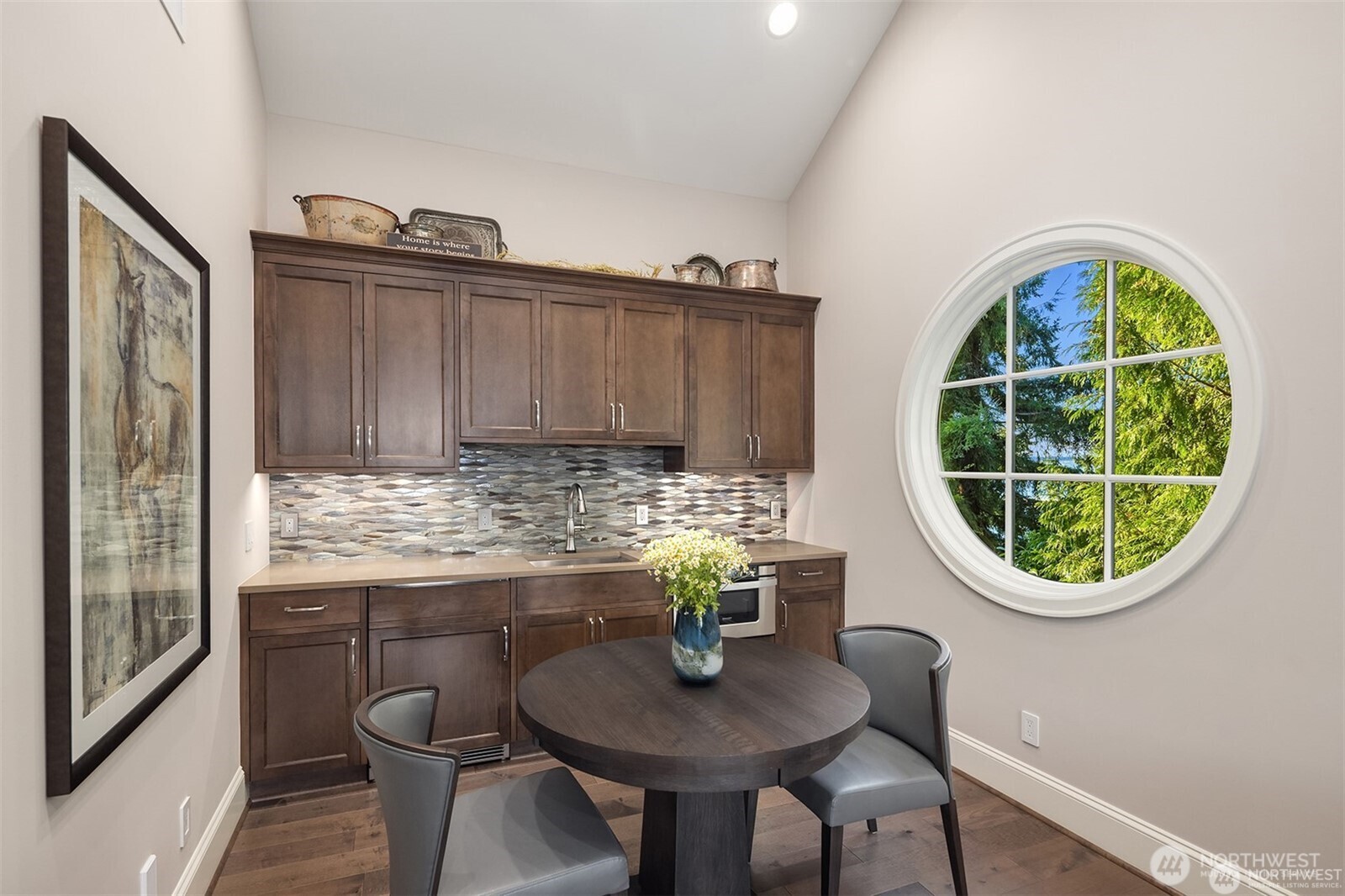 A bonus room complete with its won bistro bar creates the perfect "hangout" for relaxing.