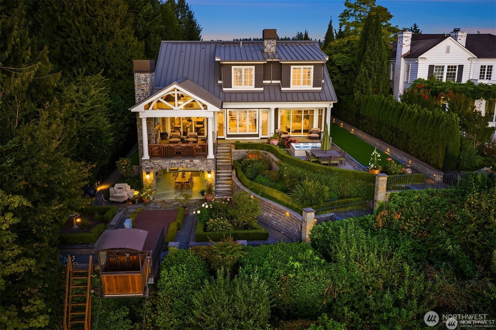 The outdoors is truly paradise for those who savor views and the art of al fresco living. Enjoy the hot tub and bocce court for play with friends. Beautiful gardens, two covered areas and endless views make this the place to be.