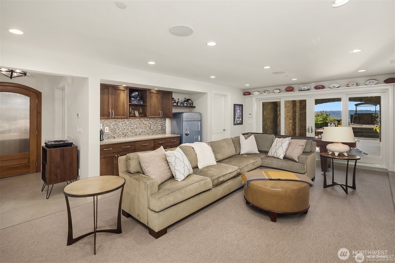 Downstairs, the entertainment level delivers year-round fun. The covered area outside is great for cozy outdoor dining. Not pictured are two HUGE storage rooms to keep you organized and ready to roll!