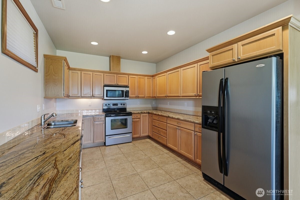 Well-appointed primary bath offering comfort and convenience within the private owner's retreat.