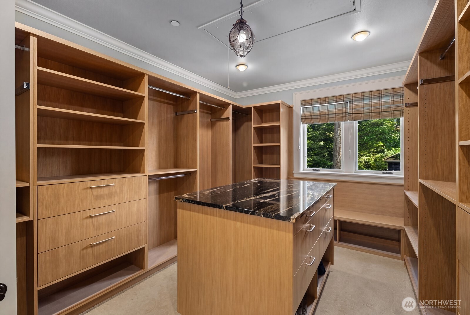 The custom closet offers boutique-style organization with extensive built-ins, generous storage, and dedicated space for every wardrobe collection.