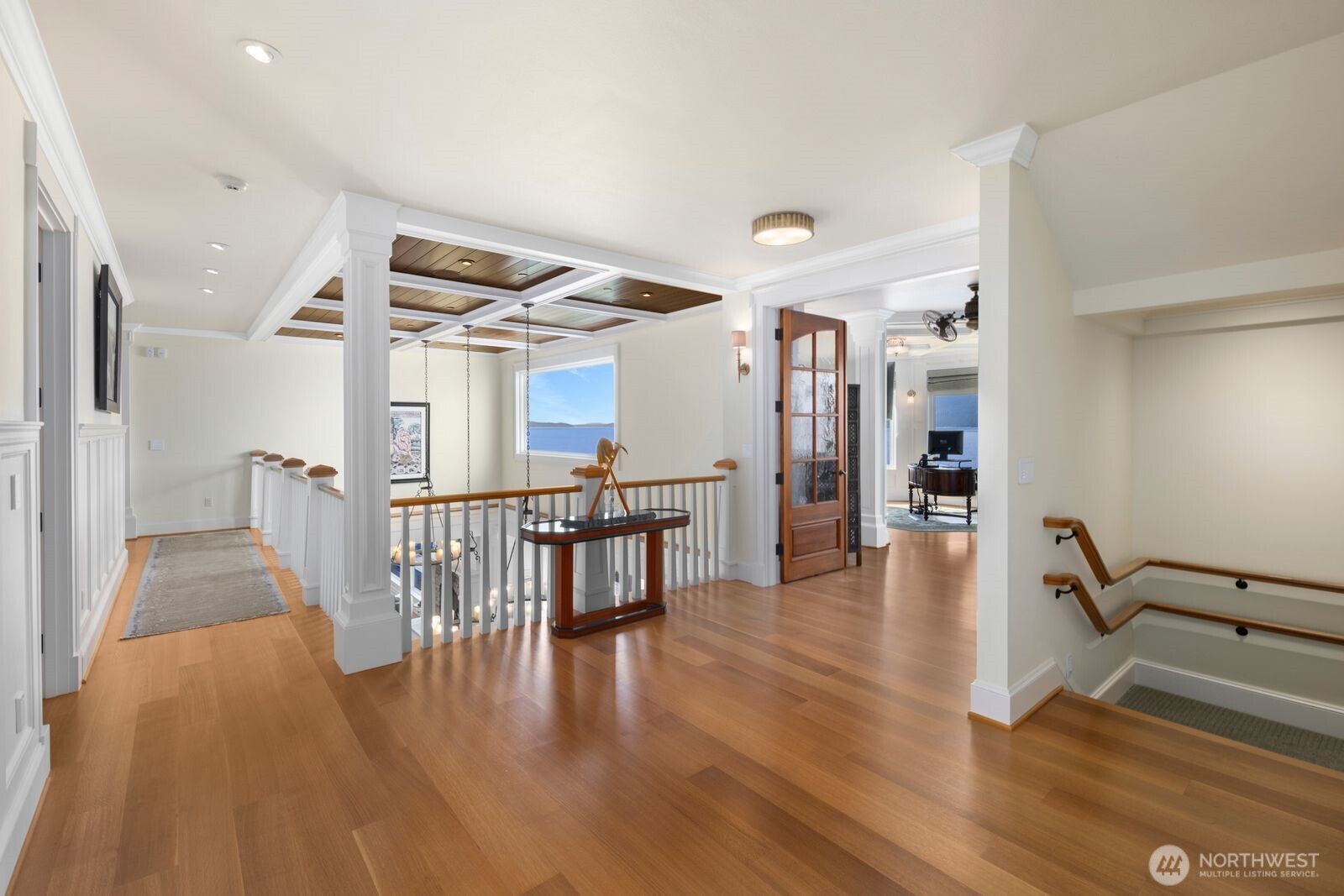 Expansive hallways and open sightlines create a seamless connection between the home's private retreats and gathering spaces.